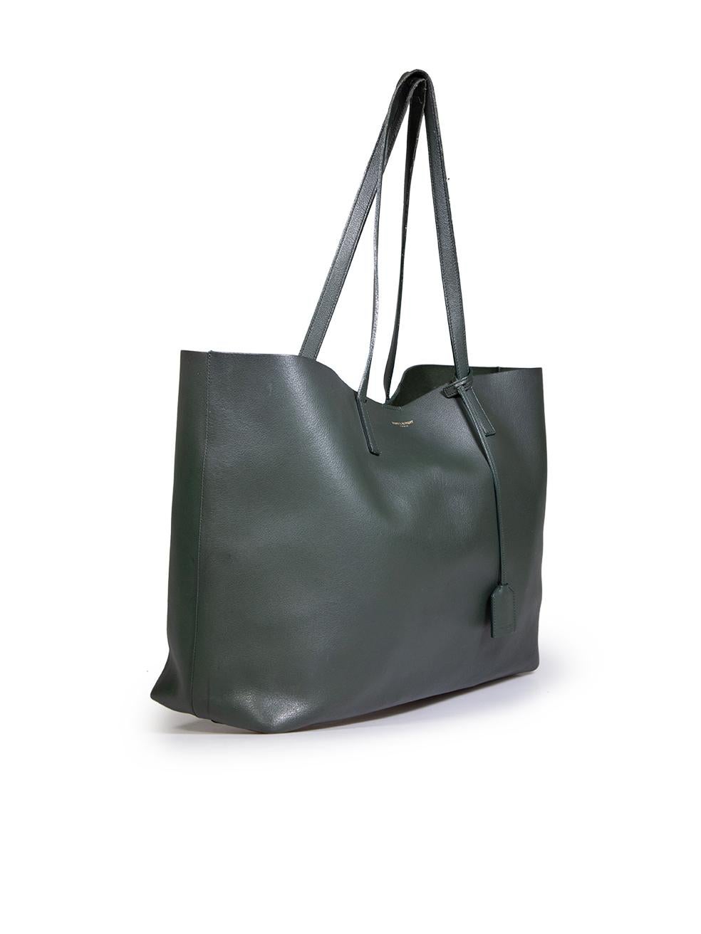 CONDITION is Good. General wear to bag is evident. Small abrasions to the bottom four corners. The handles have areas of abrasion and deterioration. There is multiple different markings along the interior lining. Detachable purse has small marks and