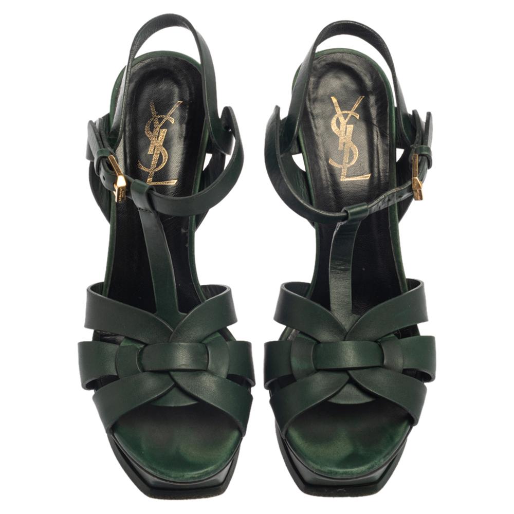 One of the most sought-after designs from Saint Laurent is their Tribute sandals. They are such a craze amongst fashionistas around the world, and it is time you own one yourself. These green ones are designed with leather straps, ankle fastenings,