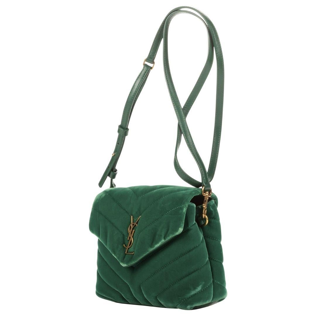 A luxurious green velvet shoulder bag with gold hardware and a foldover flap. The leather interior offers two compartments and one zippered pocket for essentials.

SPECIFICS
Length: 7.9
Width: 2.8
Height: 5.5
Strap drop: 21.7
Authenticity code: