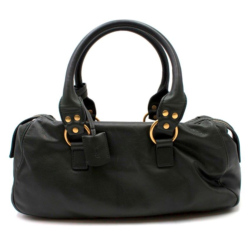 Saint Laurent Green Muse Bag

-Green leather muse bag
-Gold toned hardware
-Gold toned twist clasp
-One main interior pocket with one slot and one zipped pocket
-One exterior pocket

Please note, these items are pre-owned and may show signs of being