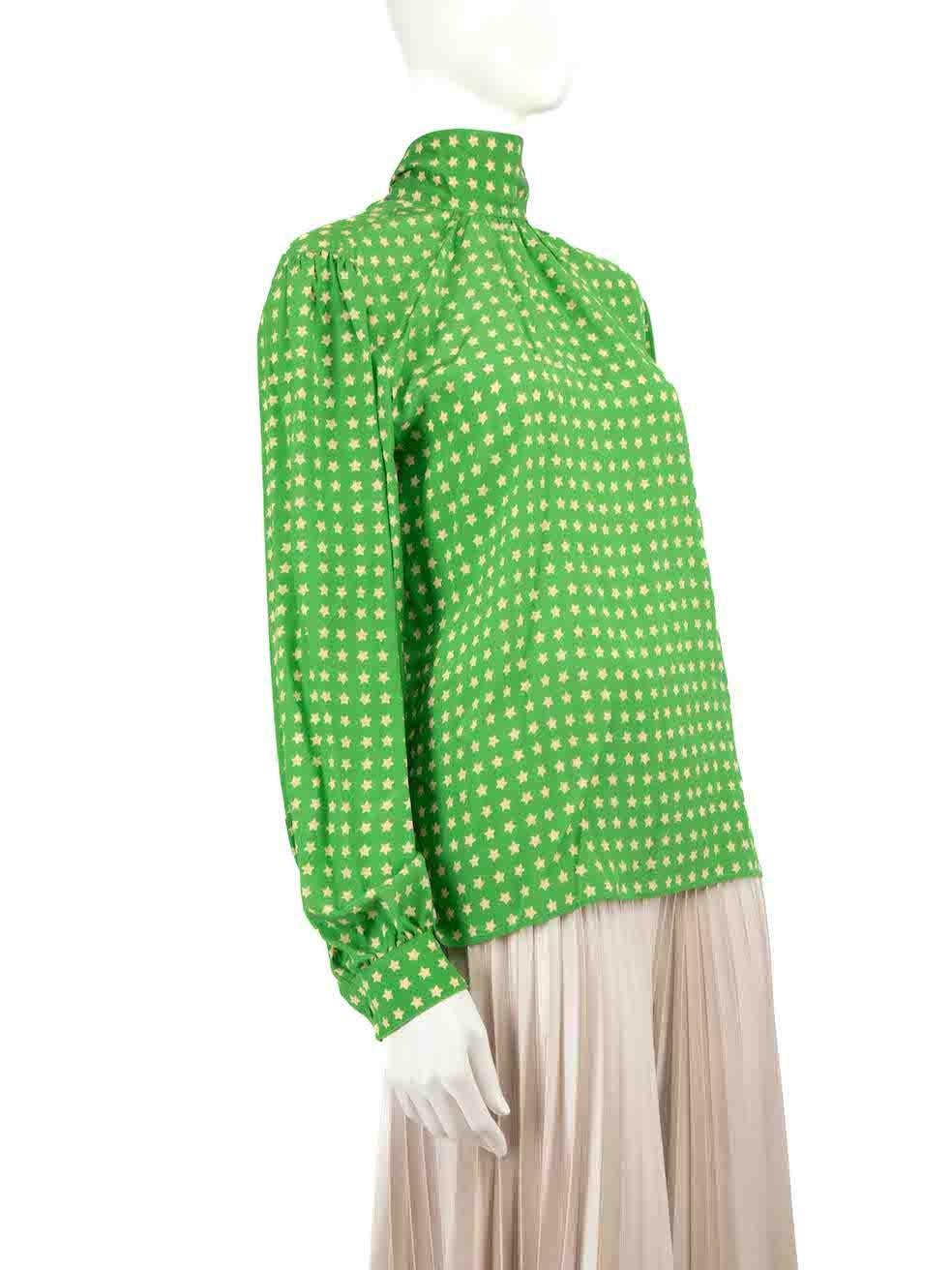 CONDITION is Very good. Hardly any visible wear to blouse is evident on this used Saint Laurent designer resale item.
 
 Details
 Green
 Silk
 Long sleeves blouse
 Star pattern
Tie neck strap with button
Buttoned cuffs
Mock neckline

Made in Italy
