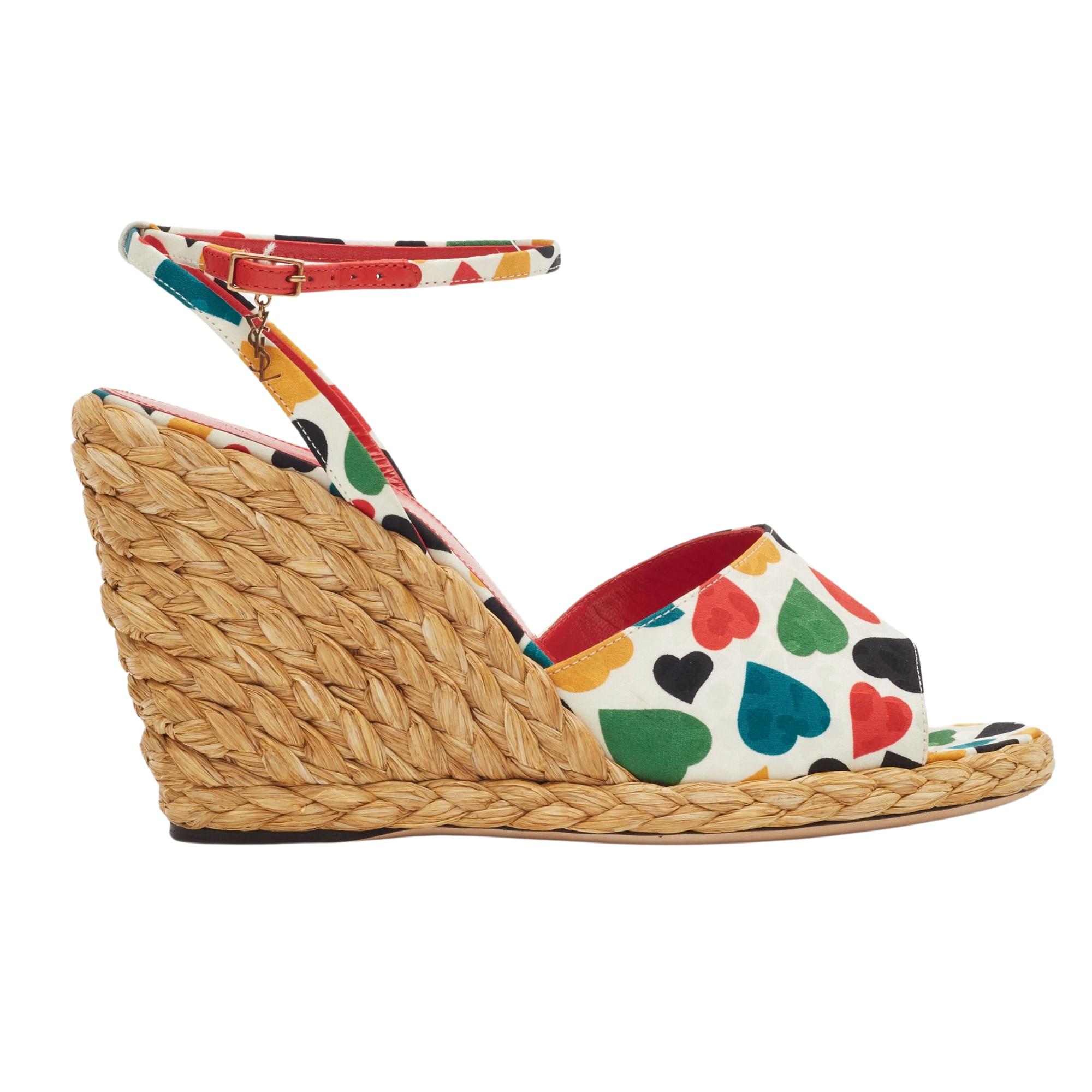 SAINT LAURENT HEART PRINT MULTICOLOURED WEDGE ESPADRILLES

Color: beige with multicoloured print
Material: rope and leather uppers
Model No. 689017
Made in Italy

EU 39 / US 8

Heel Height: 95 mm / 3.75”

Comes with: Dust bag and shoe box
Condition: