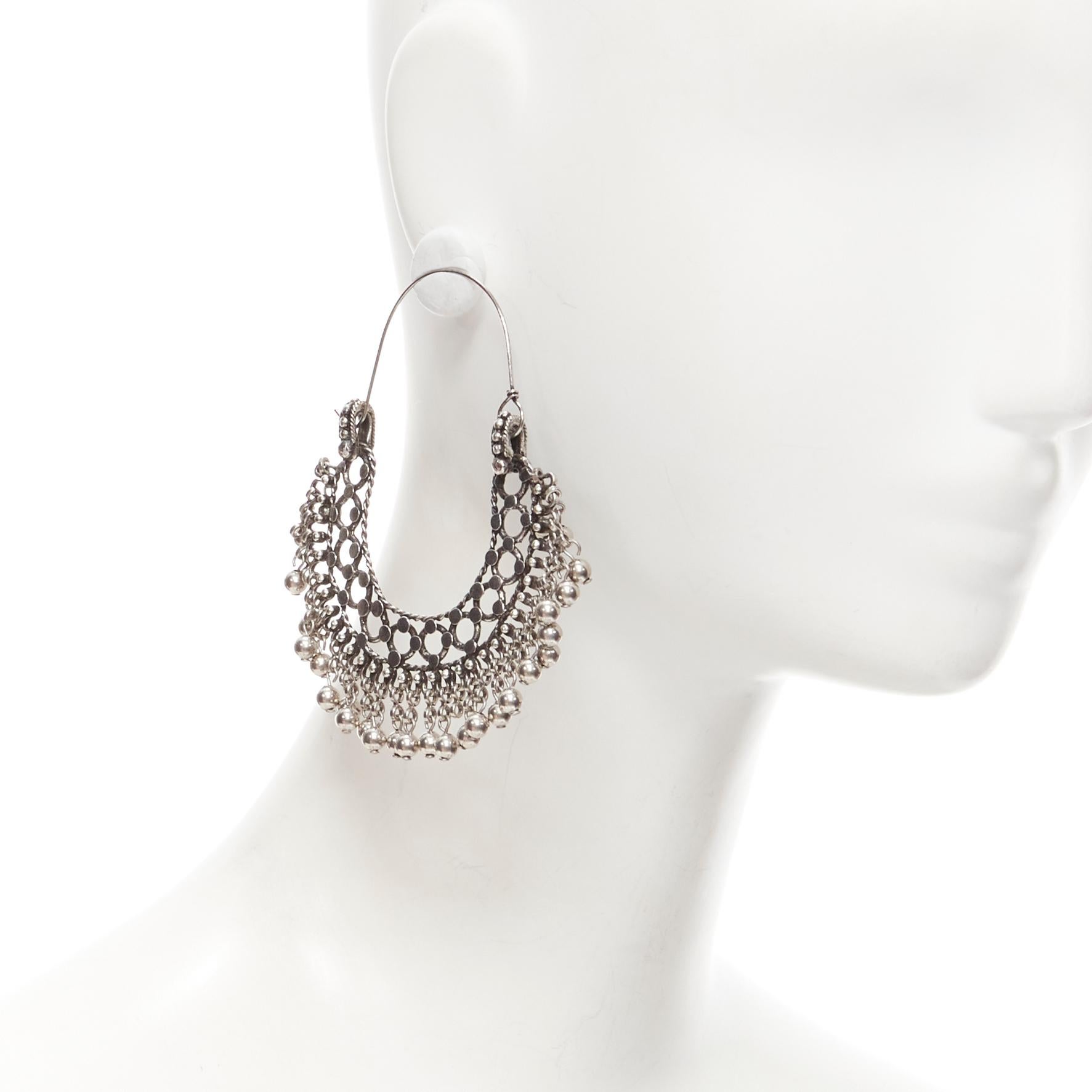 SAINT LAURENT Hedi Slimane Marrakech Folk ball charm ethnic silver metal hoop earring Pair
Reference: TGAS/E00622
Brand: Saint Laurent
Designer: Hedi Slimane
Model: Marrakech Folk earrings
Material: Brass
Color: Silver
Pattern: Solid
Closure: