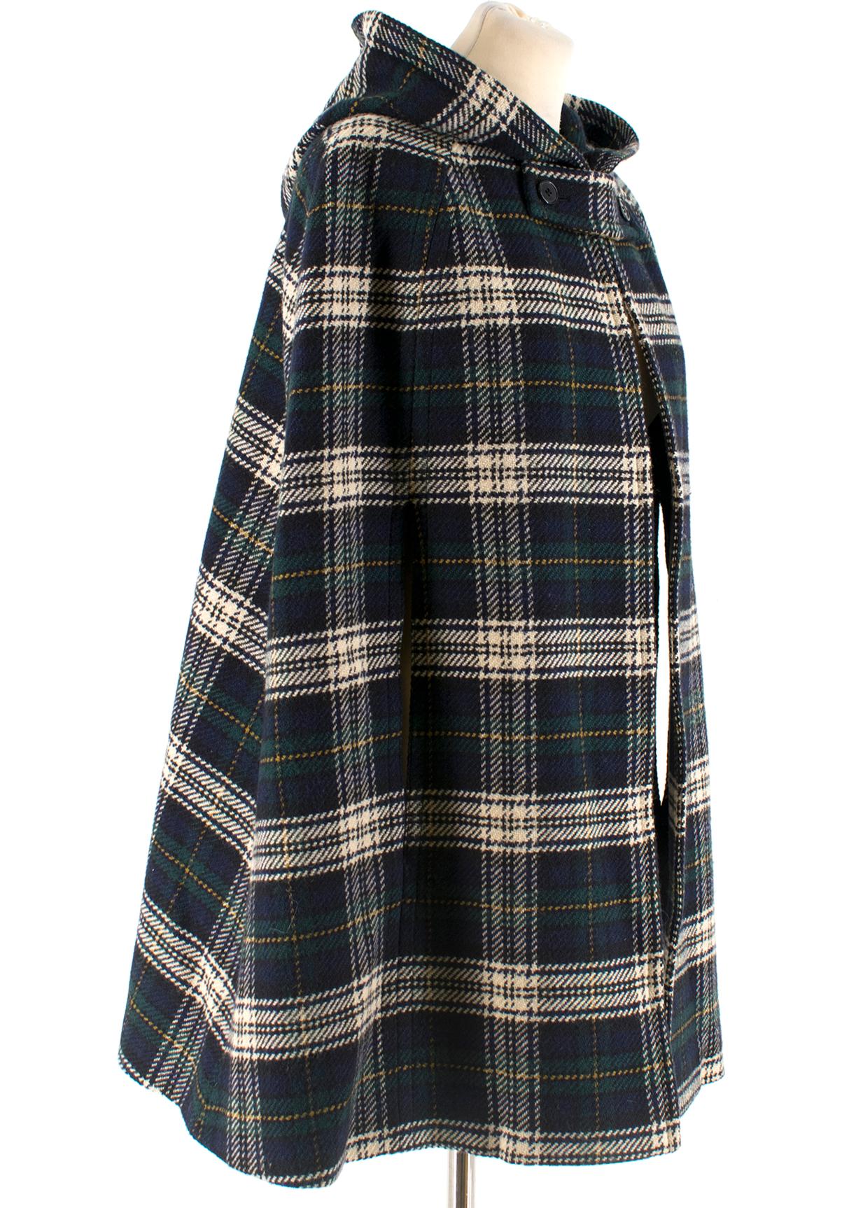 Saint Laurent Hooded Plaid Wool Cape

- Fastens at neck 
- Hand slits at sides
- Attached hood in back
- Thick, warm material

Please note, these items are pre-owned and may show signs of being stored even when unworn and unused. This is reflected