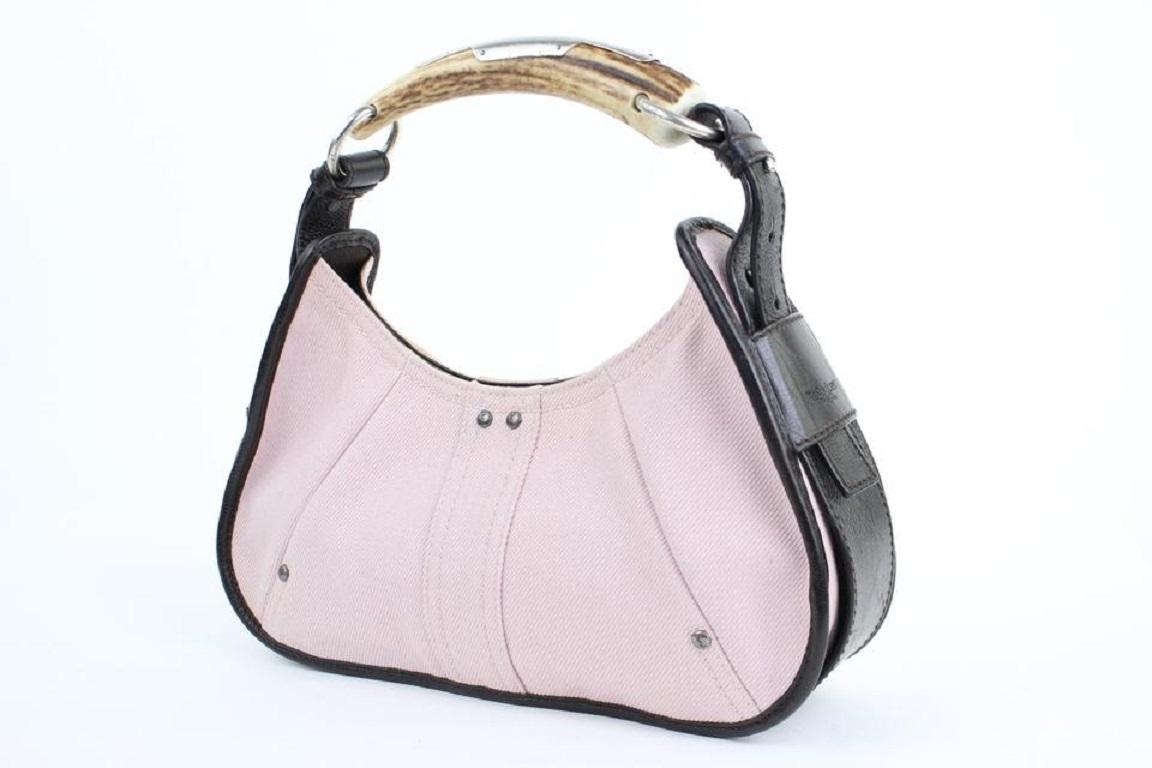 This item will ship out immediately.
Previously owned, unless otherwise stated.
Exterior Color/Material: Pink cotton denim textile
Trim- Color/Material: Brown leather
Stitching- Color: Pink and brown
1 Handles
Silver Hardware
Feet: None
Closure: