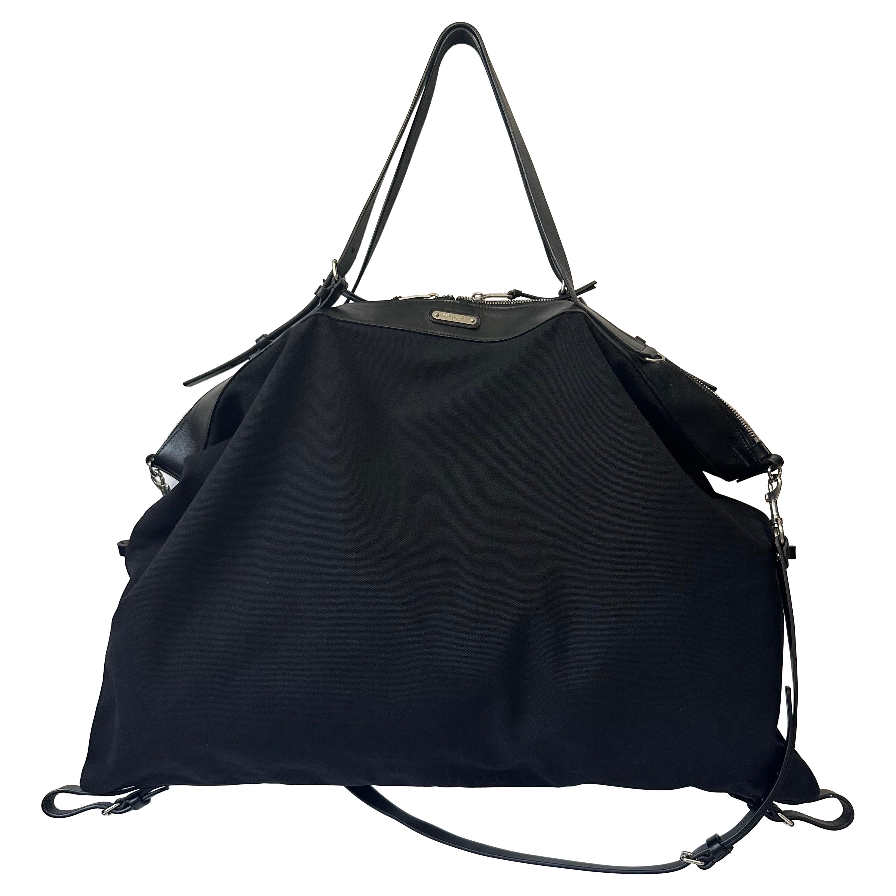 Saint Laurent ID Borsa da viaggio convertibile grande in tela nera con finiture in pelle