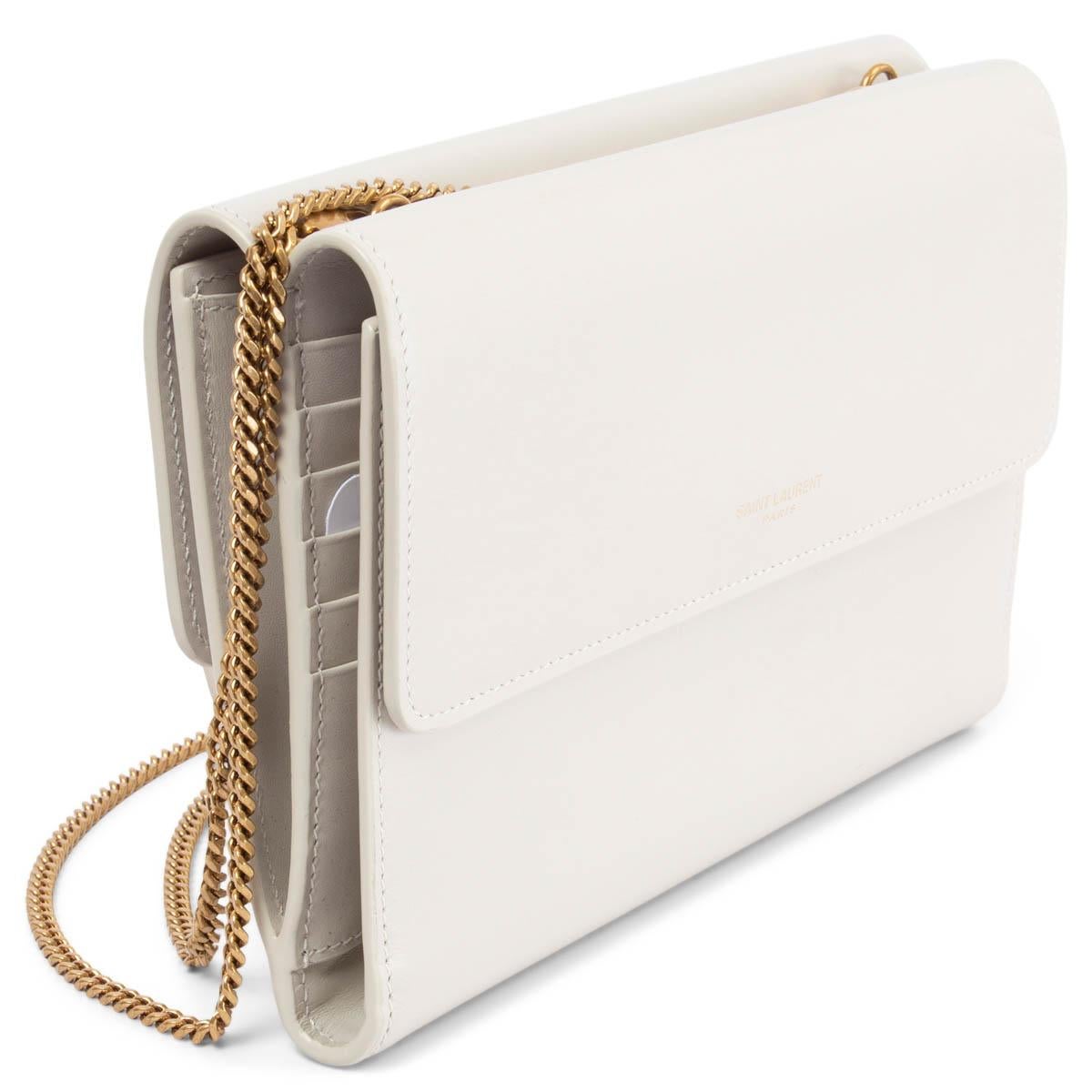 100% authentic Saint Laurent Double Flap bag in ivory smooth calf leather featuring antique gold-tone metal chain and debossed logo at front. The design opens from both sides with a flap and magnetic snap closure. Lined in smooth ivory calfskin with