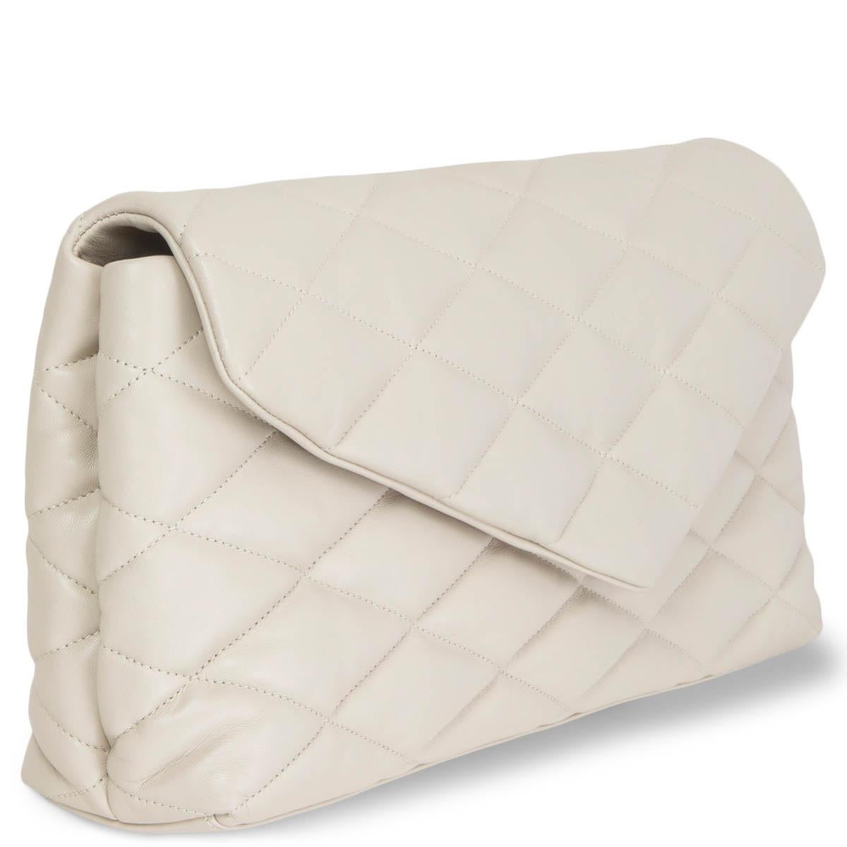 100% authentic Saint Laurent Sade Puffer Envelope clutch in Blanc Vintage (white with grey undertone) smooth quilted lamb leather. Opens with a magnetic-tab fastening under the flap and is lined in black calfskin with a zip pocket against the back.
