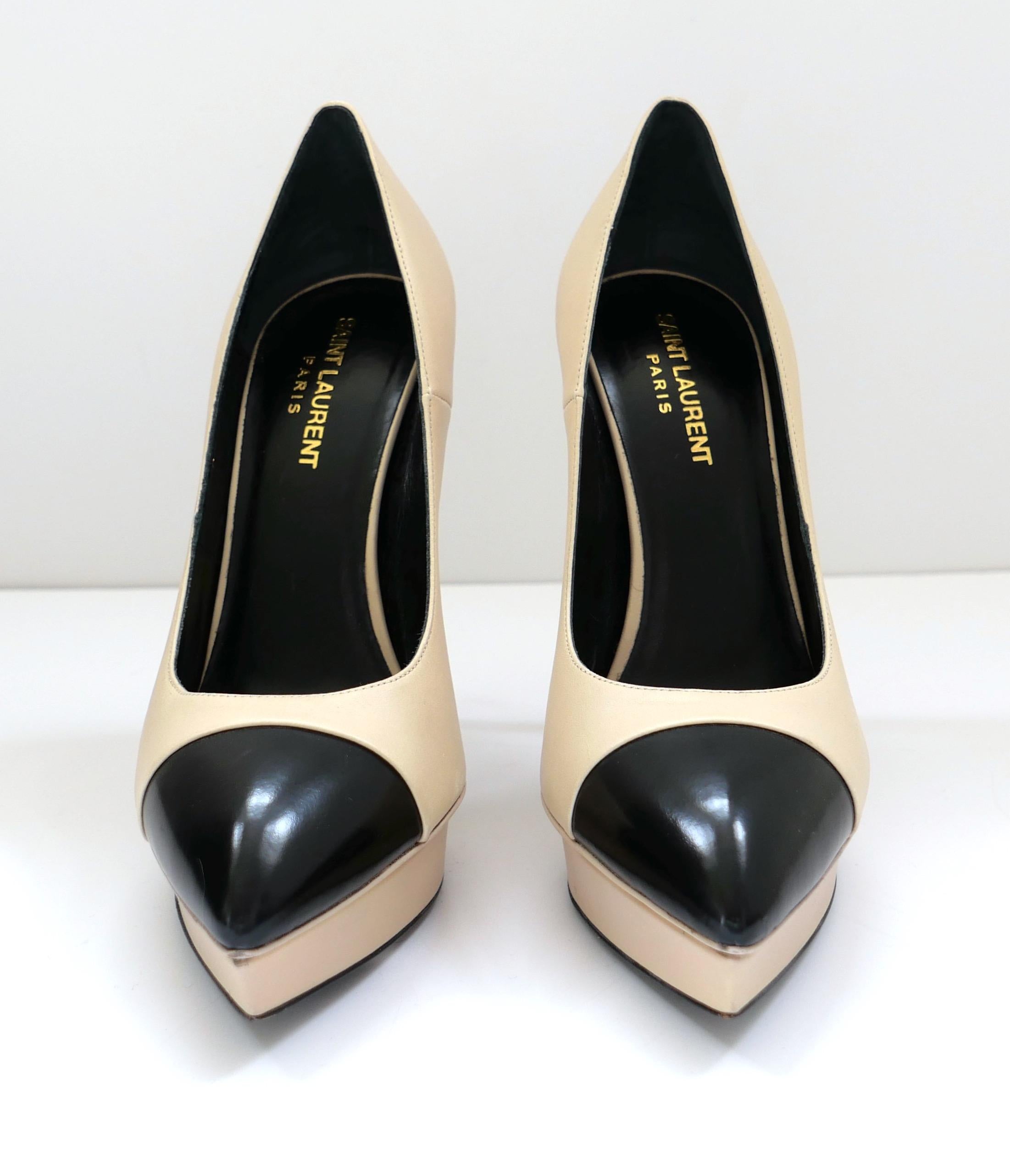 Sexy smart Saint Laurent Janis platform pumps. Worn once. Made from smooth beige leather with glossy black leather toe caps, they have inset platforms, pointed toes and towering stiletto heels. Size 39. Measure approx - 10” heel to toe inside,