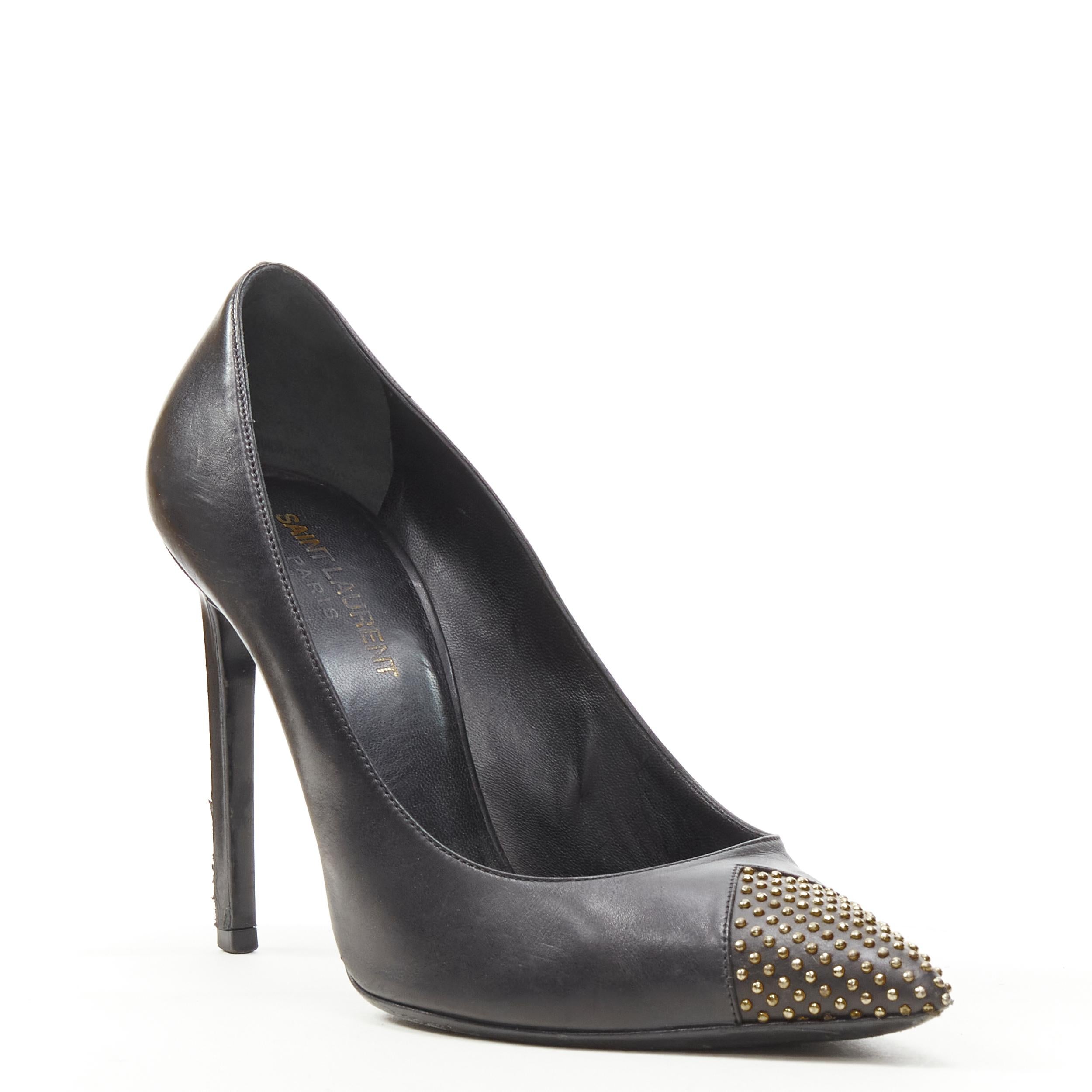 SAINT LAURENT Janis black leather gold icro stud toe cap high heel pump EU38 
Reference: KEDG/A00124 
Brand: Saint Laurent 
Model: Janis 
Material: Leather 
Color: Black 
Pattern: Solid 
Made in: Italy 

CONDITION: 
Condition: Fair, this item was