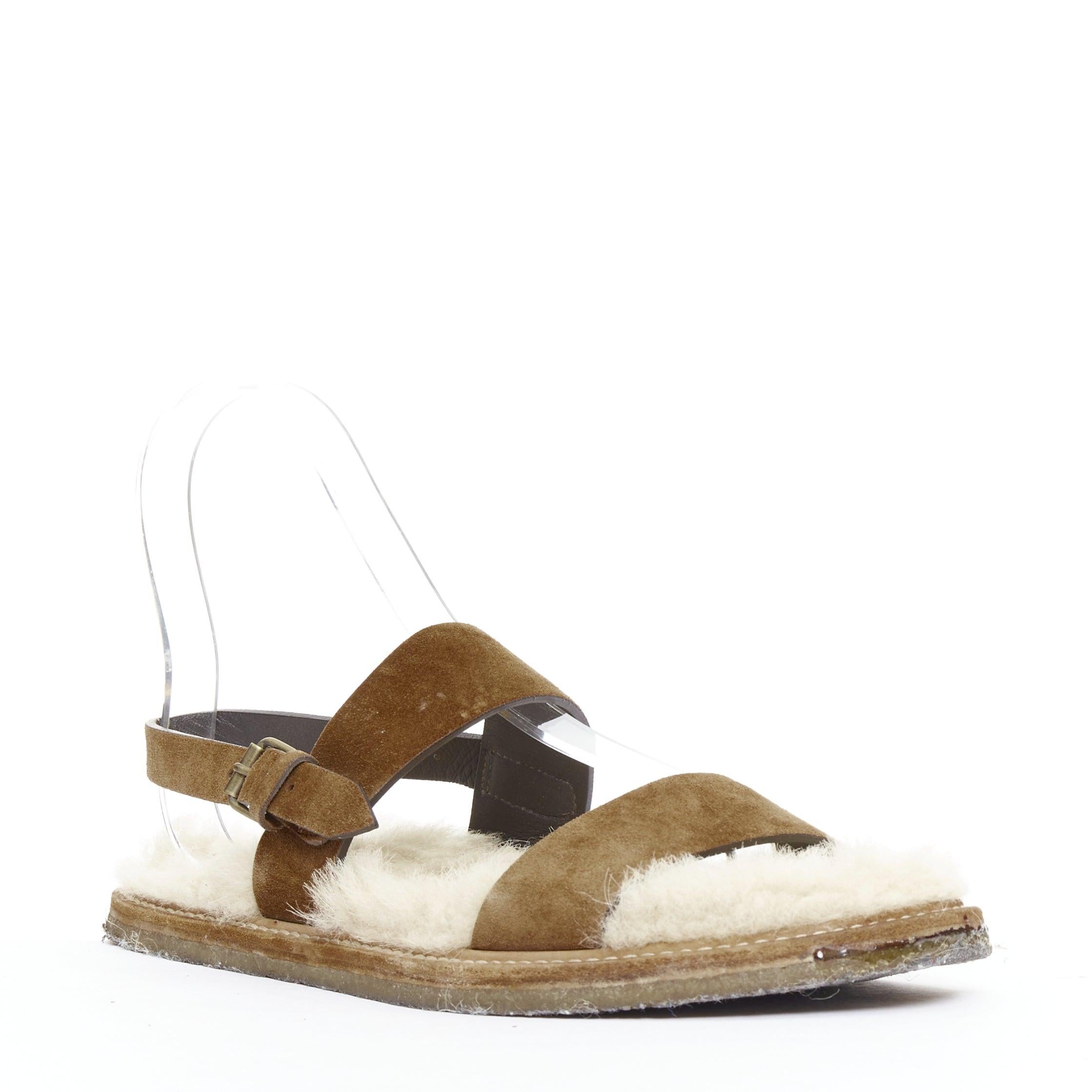 SAINT LAURENT Joan Noe tan leather cream shearling lined sandals EU38
Reference: JACG/A00221
Brand: Saint Laurent
Designer: Anthony Vaccarello
Model: Joan Noe 05
Material: Suede, Shearling
Color: Tan Brown, Cream
Pattern: Solid
Closure: