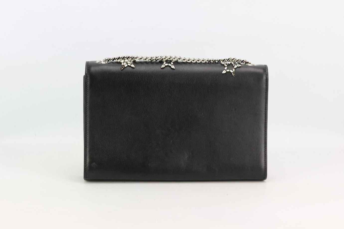 Saint Laurent Kate Monogramme Medium embellished leather shoulder bag. Made from black leather with crystal-embellishment in the shape of stars and finished with silver-tone hardware, it has a large interior compartment. Black. Magnetic fastening at