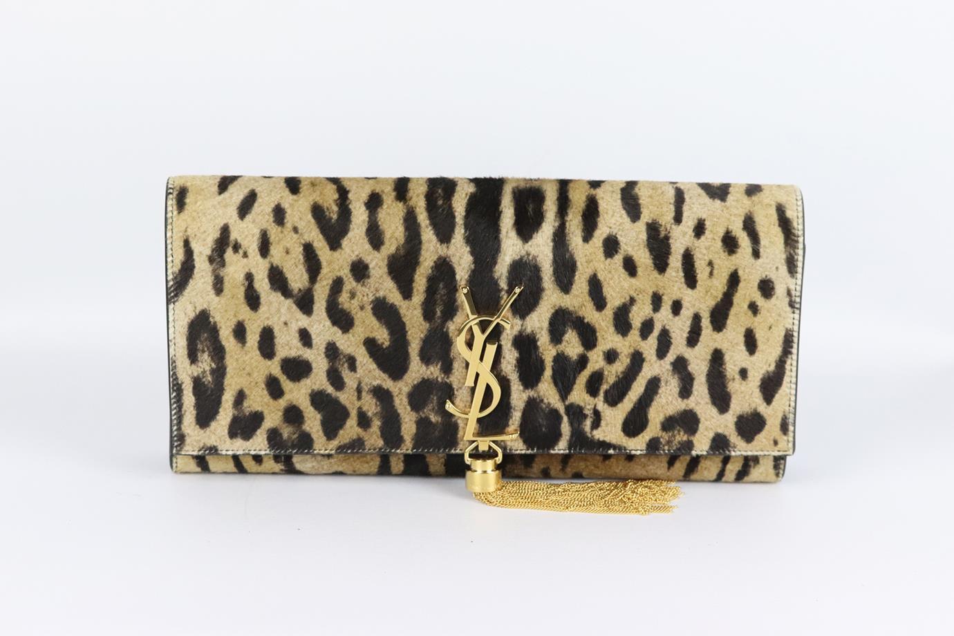 Saint Laurent Kate Monogramme leopard print calf hair and leather clutch. Made from brown and black leopard-print calf-hair and black leather with large gold-tone YSL plaque and tassel on the front, it has a large internal compartment with card