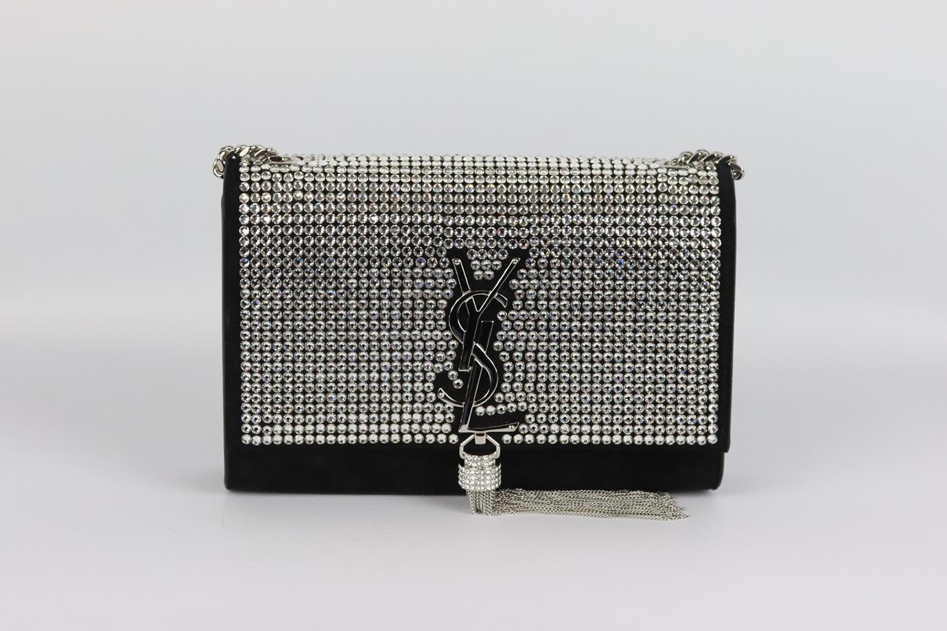 Saint Laurent Kate Monogramme small crystal embellished suede shoulder bag. Made from black suede with crystals on the front flap and finished with the brand’s signature 'YSL' plaque and chain tassel on the front in silver. Black suede. Magnetic