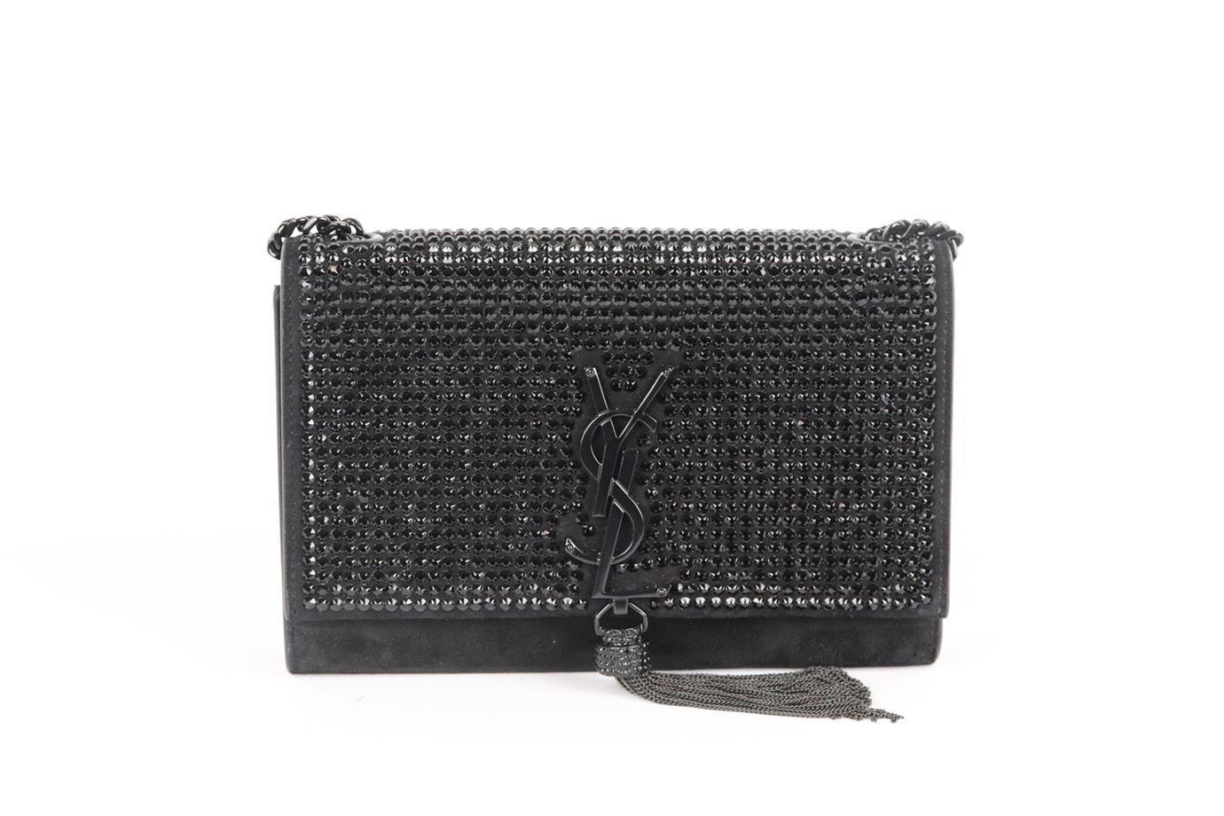 Saint Laurent Kate Monogramme small crystal embellished suede shoulder bag. Made from black suede with matching black crystals on the front flap and finished with the brand’s signature 'YSL' plaque and chain tassel on the front in matt black. Black