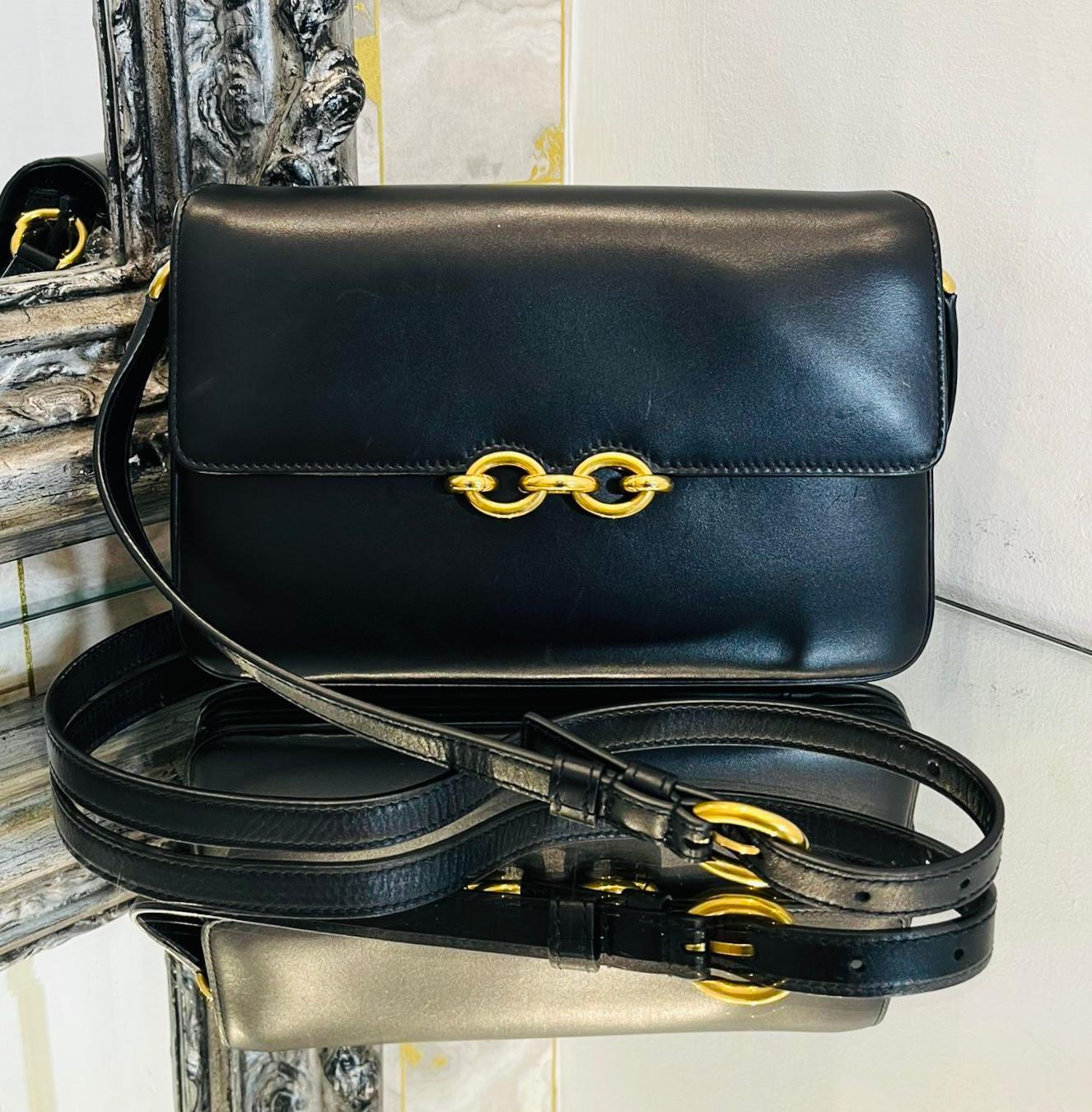Saint Laurent Le Maillon Leather Satchel Crossbody Bag

Black bag designed with front flap and gold, magnetic chain link closure.

Detailed with adjustable shoulder strap with 'Saint Laurent' logo engraved buckle and leather interior featuring zip