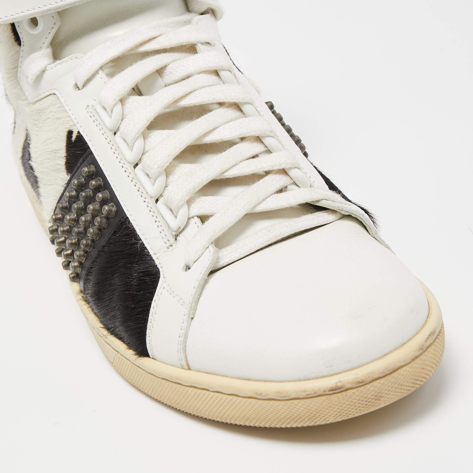 Add a statement appeal to your outfit with these Saint Laurent sneakers. Made from premium materials, they feature lace-up vamps, stud details, and relaxing footbeds.

Includes: Original Dustbag
