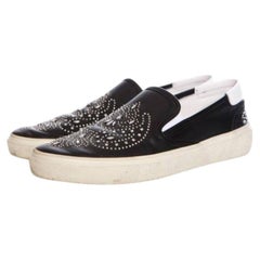 Saint Laurent, leather slip on sneakers with studs.