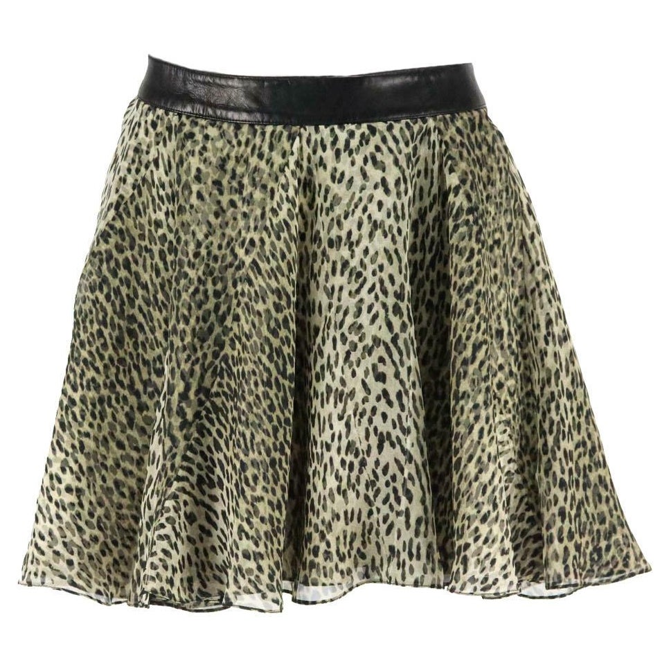 Saint Laurent - Mini-jupe en soie imprimée bordée de cuir