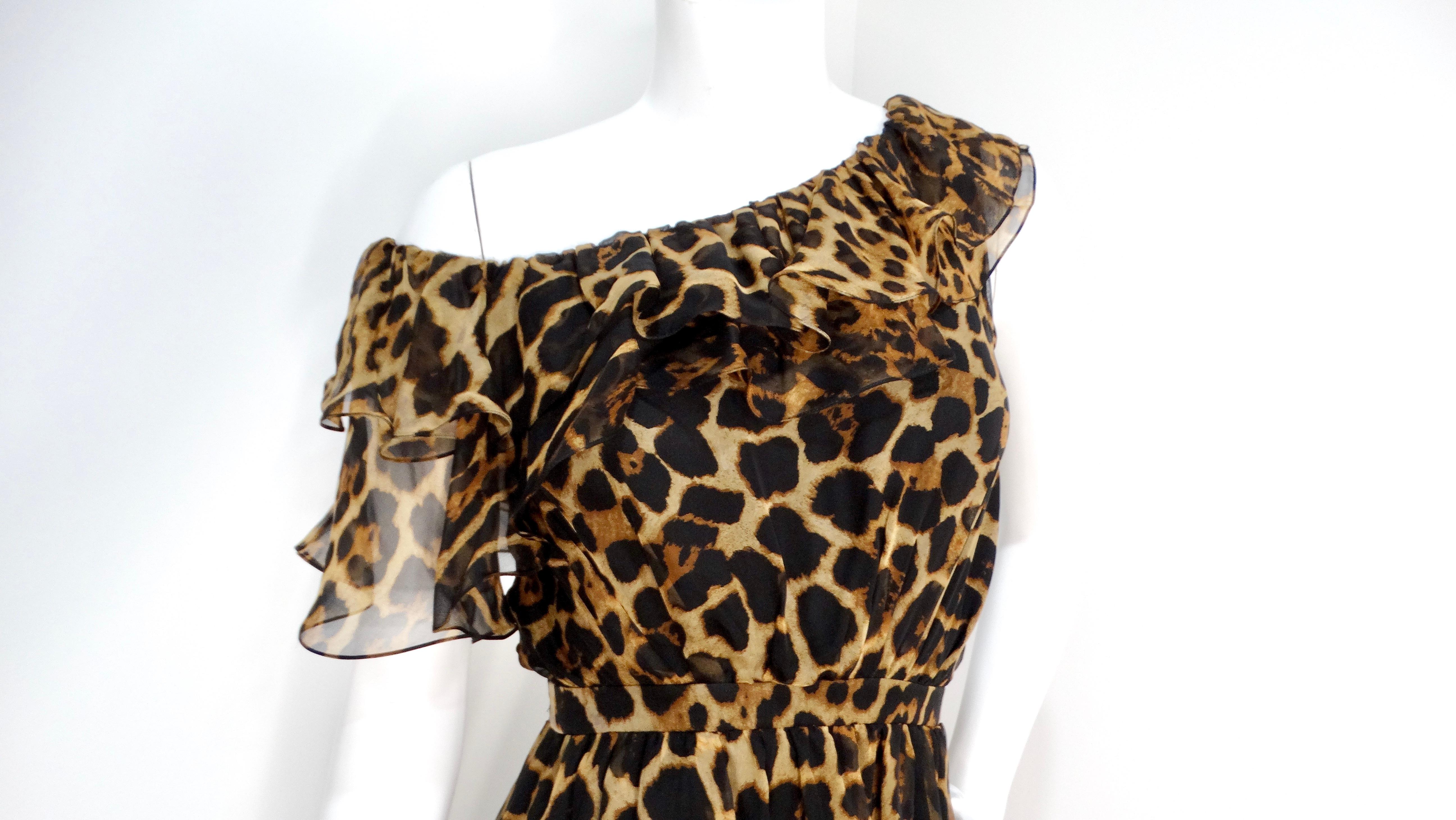 Indulge in the allure of the Saint Laurent Leopard Print Silk Off-The-Shoulder Mini Dress, a stunning addition to any fashion-forward wardrobe. Featuring a striking leopard print on luxurious silk, this dress hugs the waist snugly while flowing