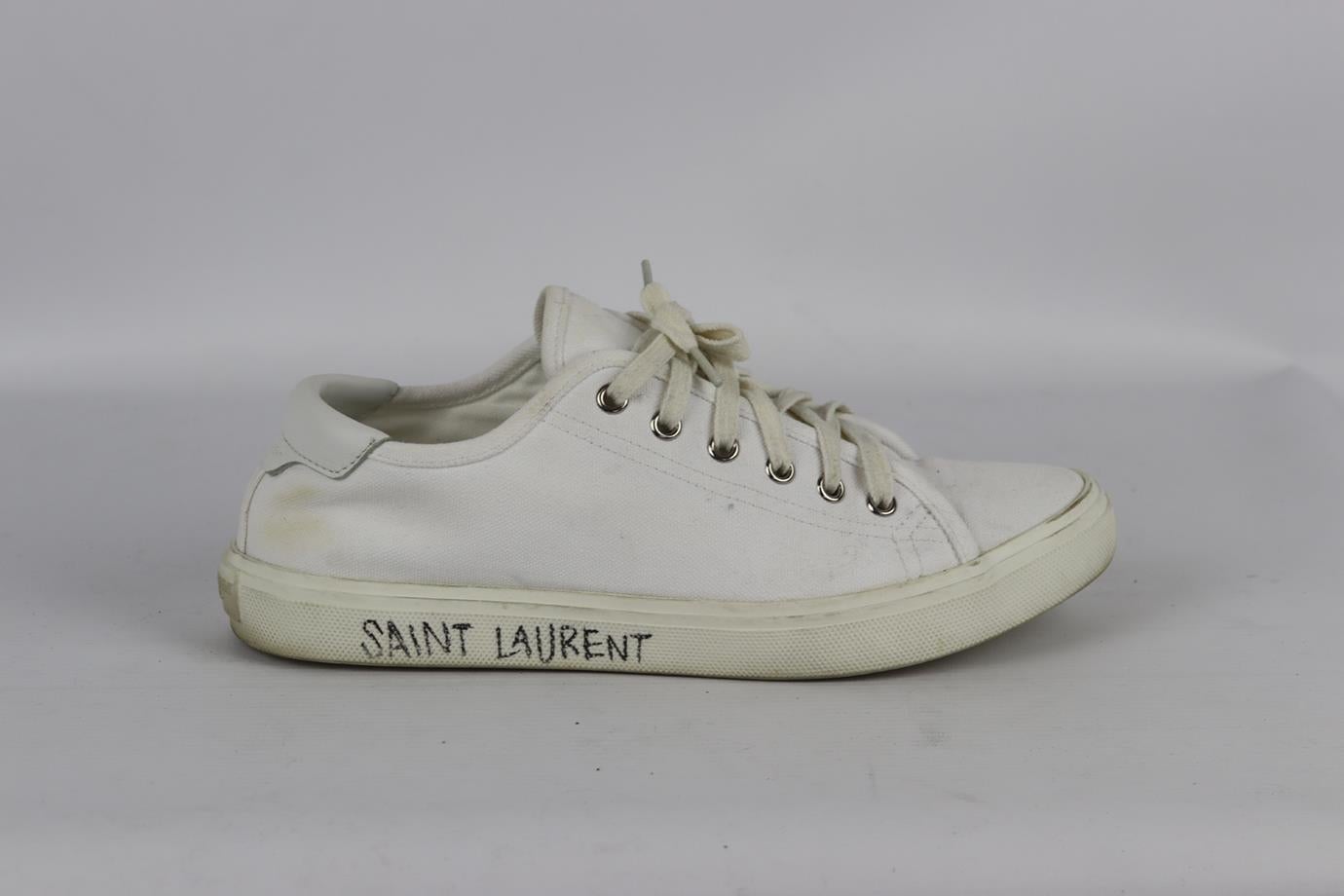 Saint Laurent logo detailed canvas sneakers. White. Lace up fastening at front. Does not come with dustbag or box. Size: EU 38.5 (UK 5.5, US 8.5). Insole: 9.6 in. Heel Height: 1 in. Very good condition - Some wear to soles. Light wear to upper
