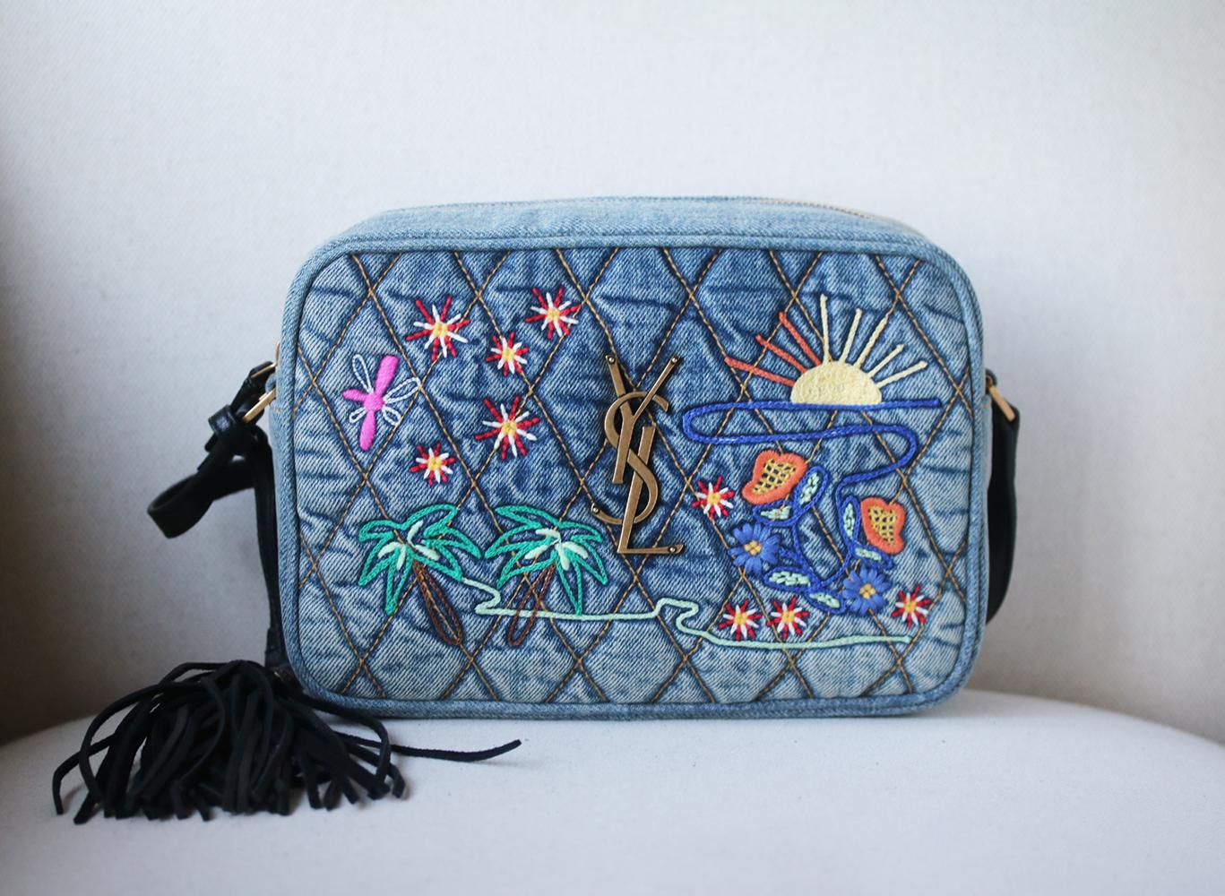 It's been made in Italy from soft quilted blue denim embroidered with flowers, palm trees and a burgeoning sunrise. Adjust the tassel-trimmed leather shoulder strap to find the perfect drop. Blue denim, black leather (Lamb). Zip fastening along top.