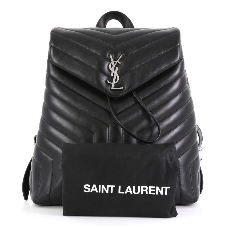 This Saint Laurent LouLou Backpack Matelasse Chevron Leather Medium, crafted in black matelasse chevron leather, features adjustable straps, leather top handle, top flap with magnetic closure, and silver-tone hardware. Its drawstring closure opens