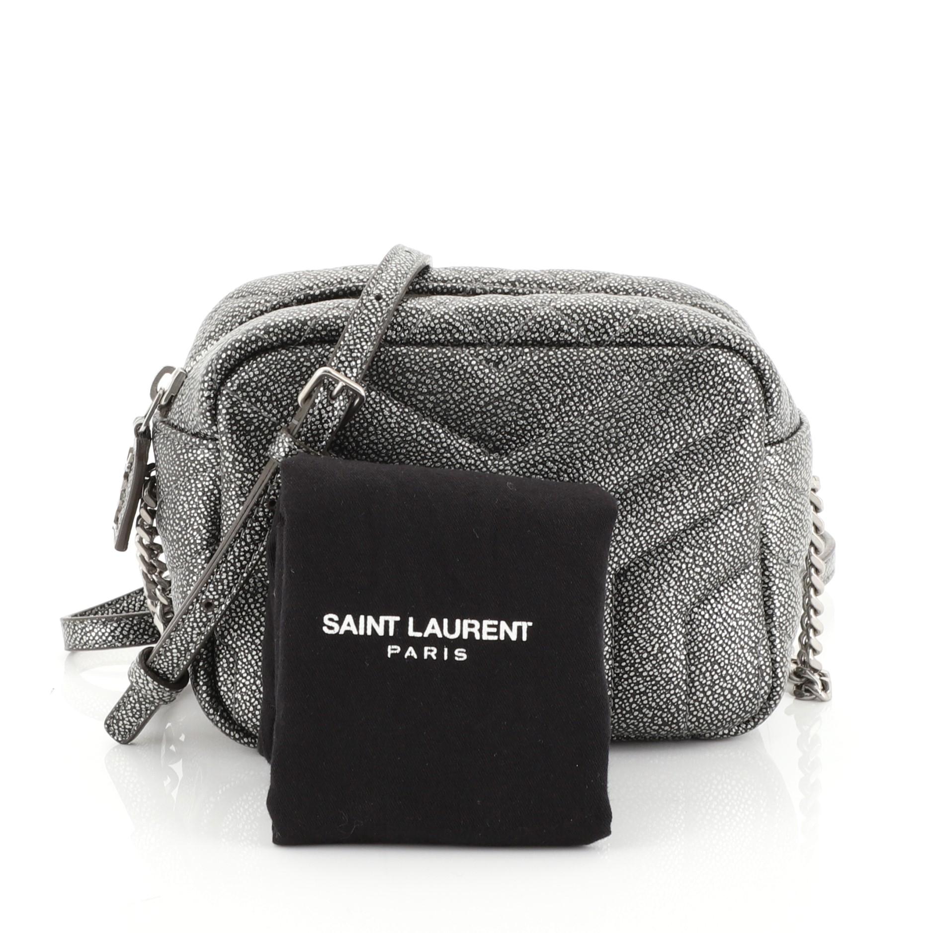 This Saint Laurent LouLou Bowling Bag Matelasse Chevron Leather Mini, crafted from gray matelasse chevron leather, features chain link strap with shoulder pad and aged silver-tone hardware. Its zip closure opens to a black fabric interior with slip