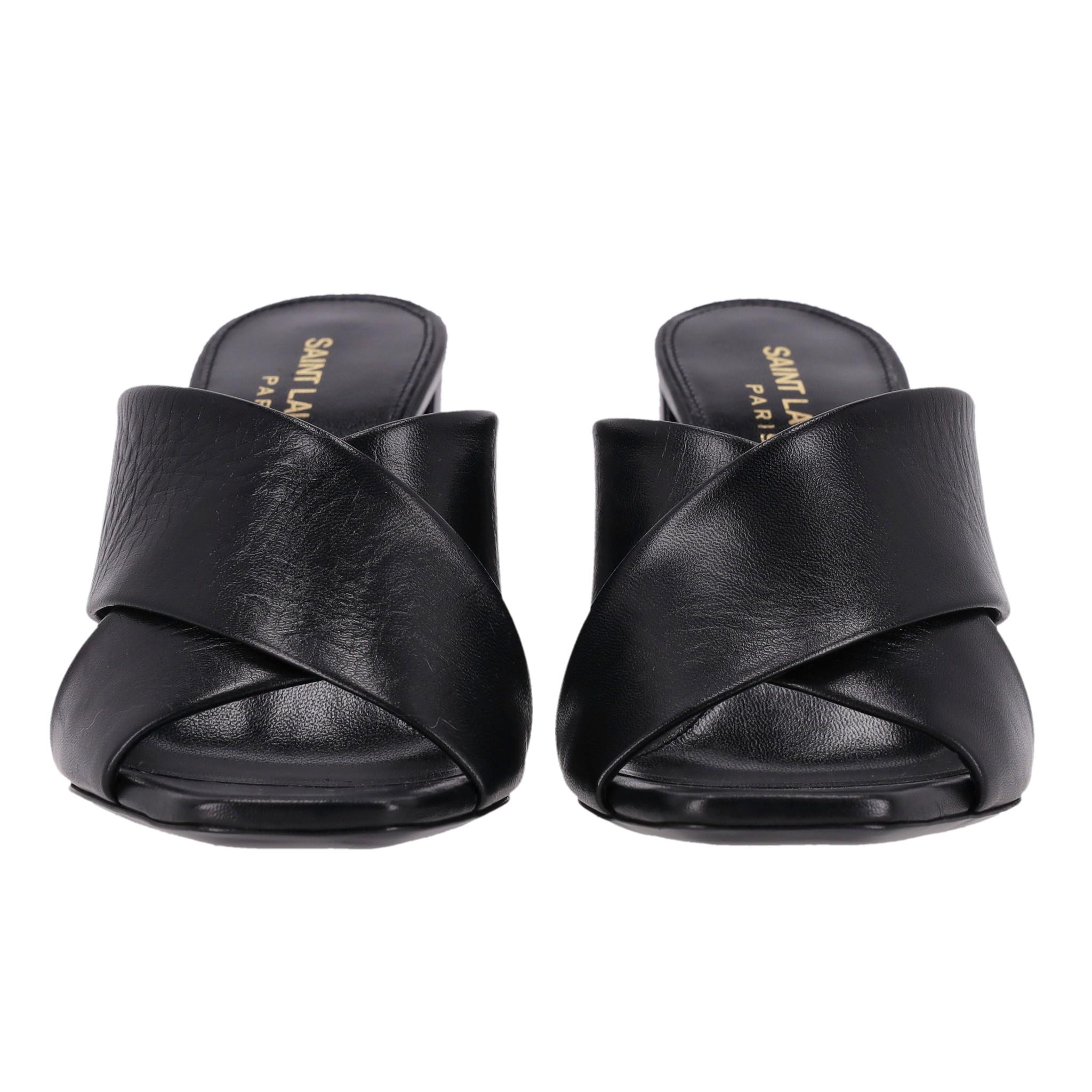 Saint Laurent Loulou Leather Heeled Mules/Sandals

Black mules designed with wide, cross-over straps at the front.

Featuring square, open toes and stacked block heel with 'YSL' logo embossment.

Rrp Approx. £750

Size – 35.5

Condition – Very
