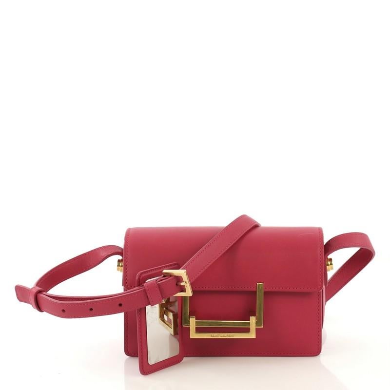 This Saint Laurent Lulu Shoulder Bag Leather Small, crafted from pink leather, features an adjustable crossbody strap, front flap with double rectangular clasp and gold-tone hardware. Its clasp closure opens to a pink suede interior divided into two
