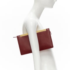 SAINT LAURENT Lutetia gold metal bar red leather rectangular clutch bag