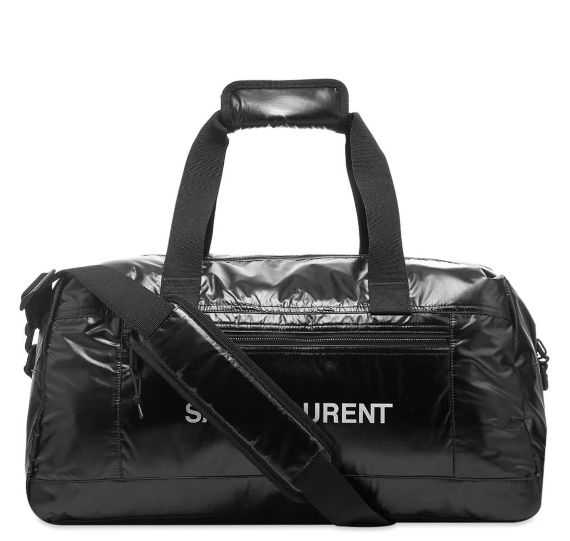 Saint Laurent NUXX Ripstop Black Nylon Duffel Bag / Travel Bag

Take Saint Laurent's sleek Parisian style on the move with this glossy black duffle bag. It’s constructed from a durable ripstop and printed with the label’s logo in bright contrasting