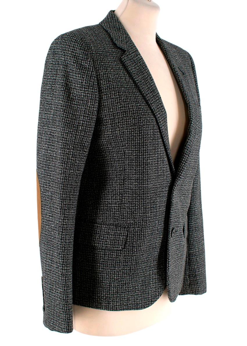 Saint Laurent Micro-Houndstooth Wool Single Breast 2 Button Blazer

- Timeless, fitted blazer jacket, cut in a micro-houndstooth virgin wool with single breast, 2 button closure
- Contrasting tan suede elbow patches on a long sleeve, with 5 button