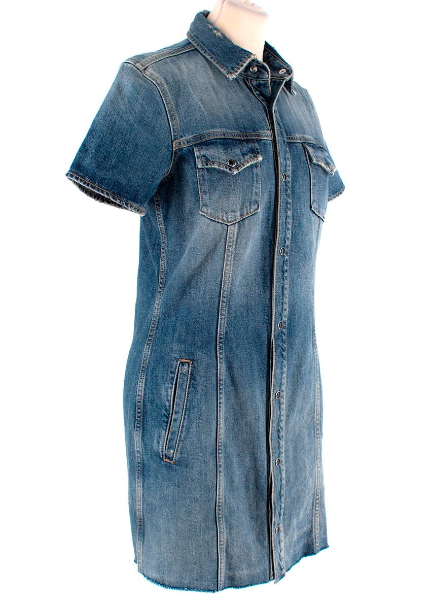 Saint Laurent Mid-WasH Distressed Denim Mini Dress
 

 - Collared, button-through mini dress in mid wash denim with distressing details to the collar , and faded patches through the body
 - Decorative topstiching 
 - Short sleeve
 - Form fitting
 -