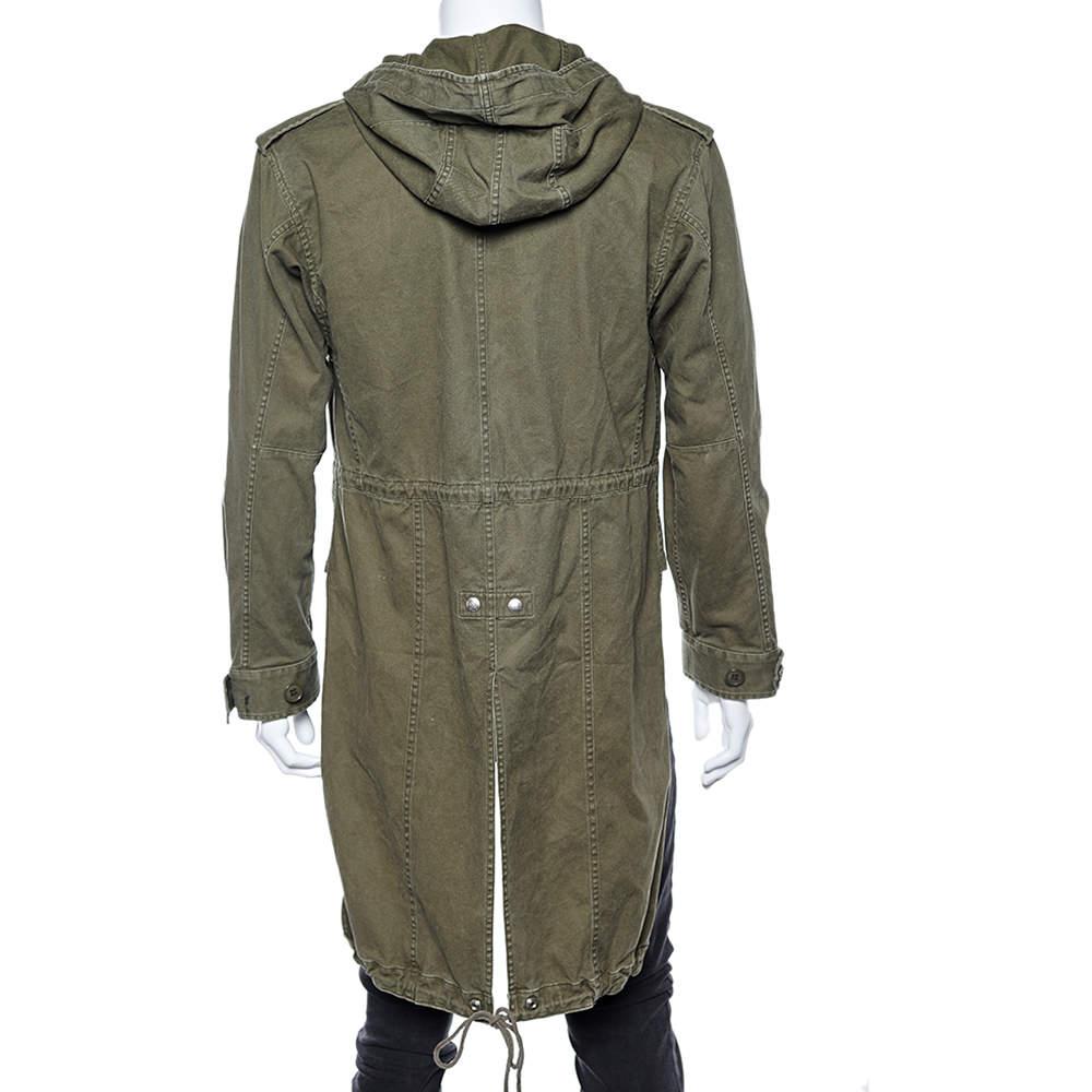 Add this classy jacket from the House of Saint Laurent to your collection and make it even more spectacular! It has been tailored using military green cotton and linen and is equipped with zip closure, a hoodie, and two external pockets. Stylish and