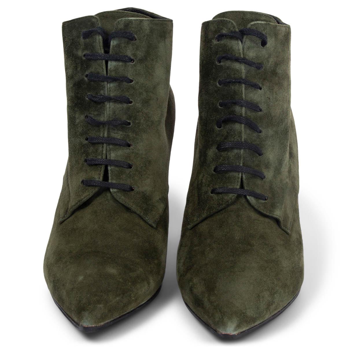 100% authentic Saint Laurent Era 85 lace-up booties in Cachemere Military (green) suede with a smooth black leather heel and a pointed-toe. Have been worn and shows some dents on the heels and soft scratches on the suede. Overall in very good