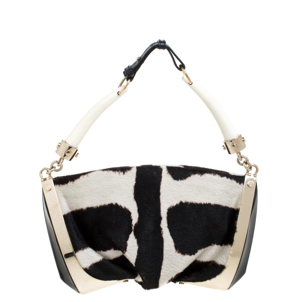 It is indeed rare for one to chance upon a shoulder bag as gorgeous as this one from Saint Laurent. It comes beautifully crafted from monochrome calfhair and designed with a double horn handle and gold-tone hardware. The bag also brings a