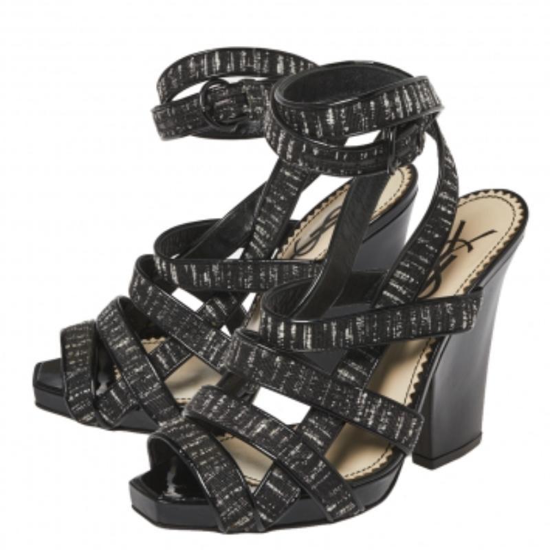 These sandals from Saint Laurent are bearers of a fine mix of shoe craftsmanship and style. The sandals have been crafted from patent leather and fabric with ankle wrap fastenings and 11.5 cm heels that will beautifully lift you and your outfits.