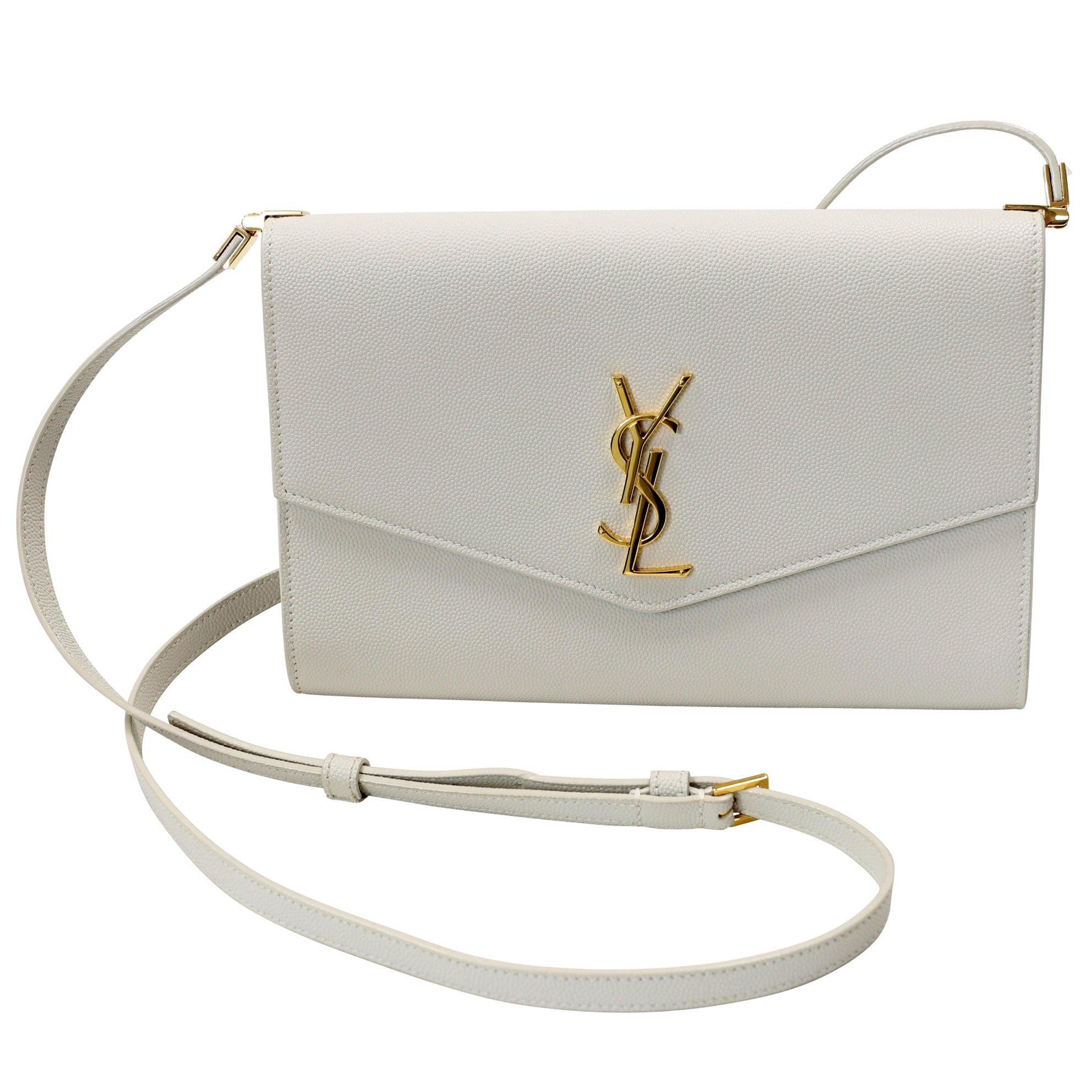 SAINT LAURENT's 'Envelope' bag is YSL traditional look made famous with signature YSL gold logo on the front. Made in Italy from grained-leather, it has a long leather shoulder strap, so you can alter the drop and is topped with a tonal logo plaque.
