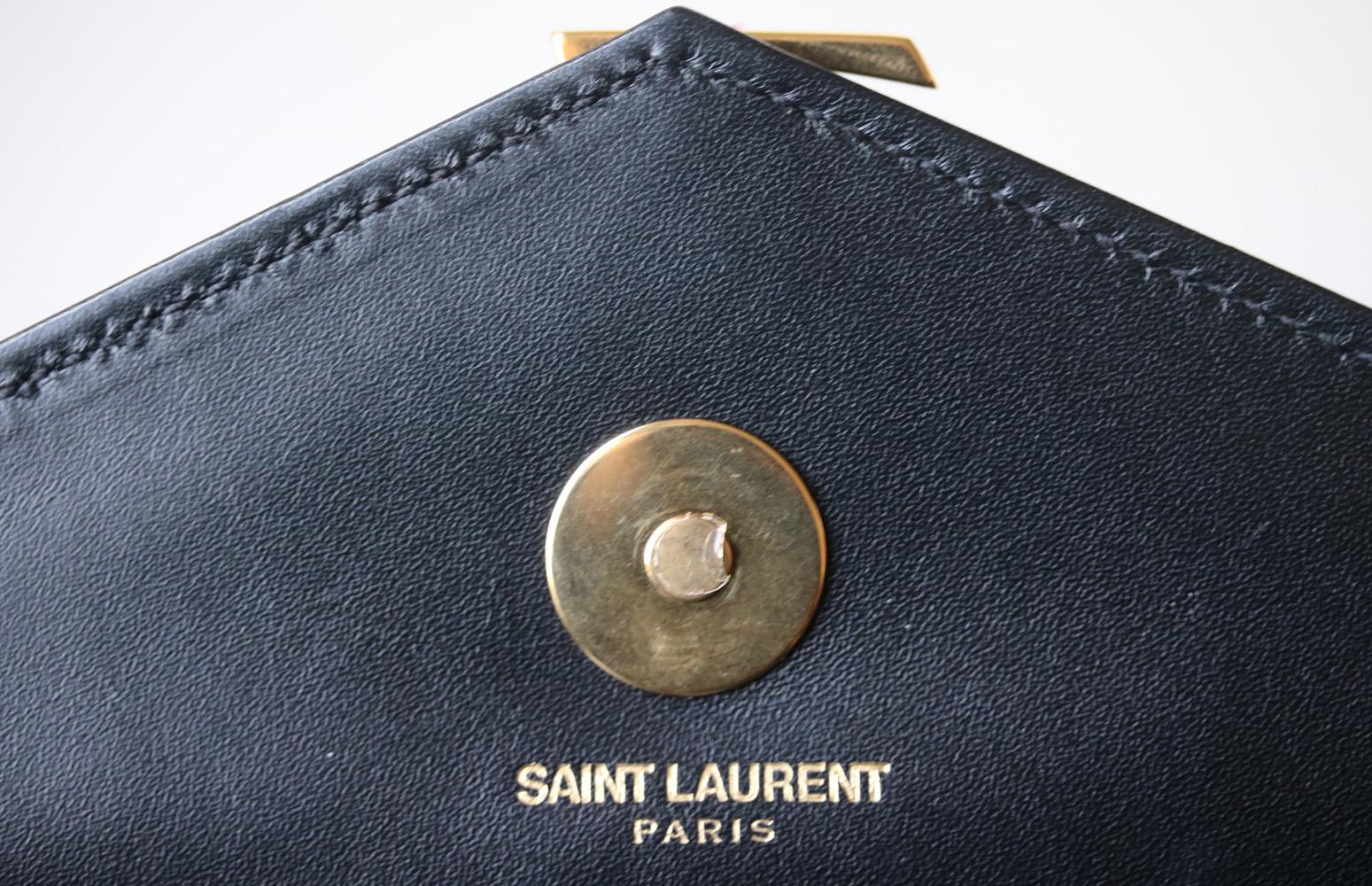 Saint Laurent Monogramme Quilted Leather Clutch In Excellent Condition In London, GB