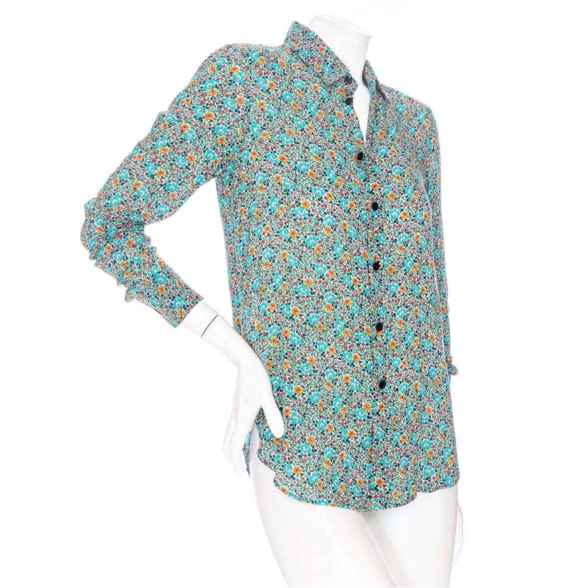 Saint Laurent Multicolored Viscose Floral-Print Long Sleeve Button Down Shirt 

Teal Blue
Multicolored florals in red, orange, green, blue and black
Long shirt sleeves with button fastening at cuffs
Shirt collar
Button down front