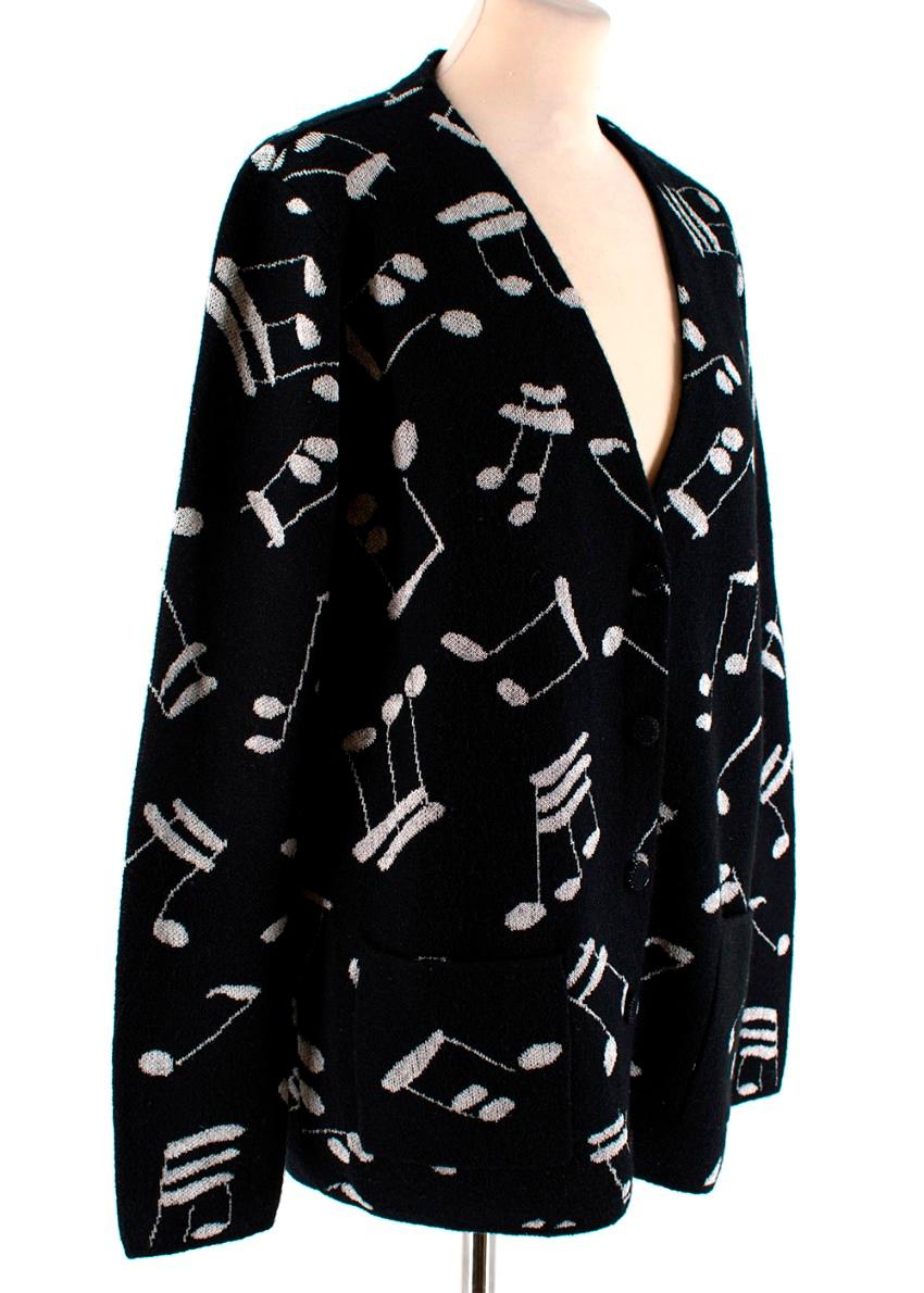 Saint Laurent Music Black Cardigan

- Knitted cardigan with music chords 
- Blend of mohair for a cosy touch
- Warm for the winter months
- V neckline with buttons to fasten
- Open pockets at the side
- Medium weight material

Made in Italy

Fabric