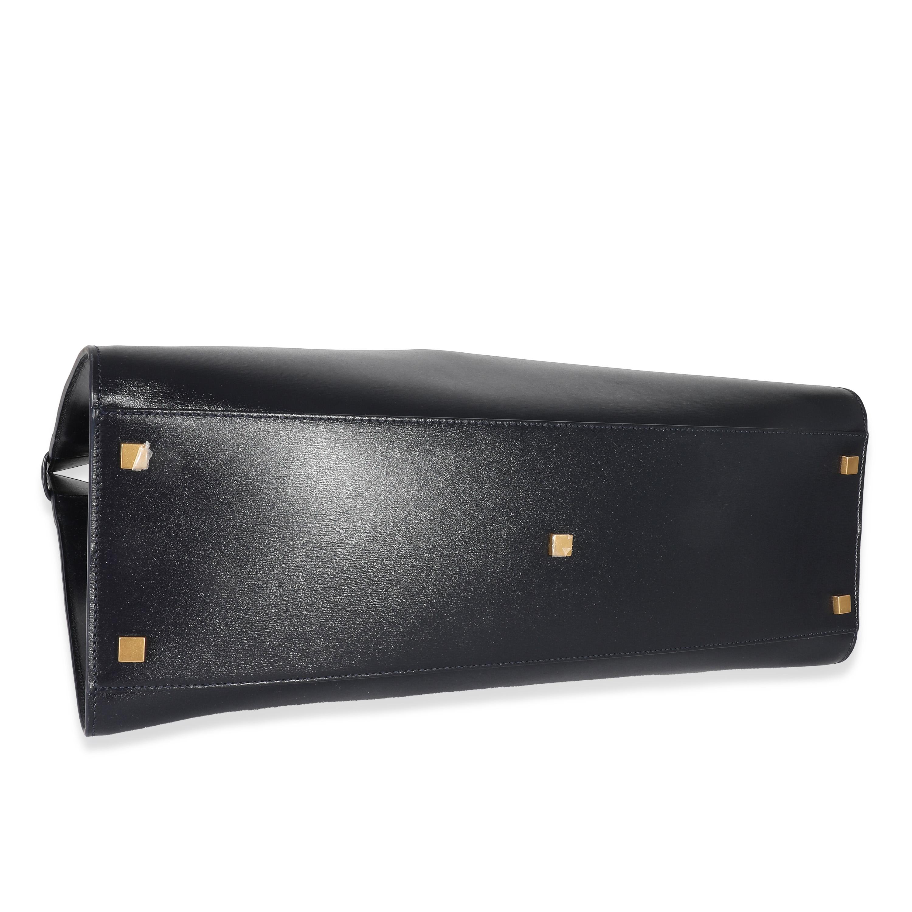 Listing Title: Saint Laurent Navy Blue Calfskin Medium Manhattan Shopper Tote
SKU: 135862
Condition: Pre-owned 
Handbag Condition: Excellent
Condition Comments: Item is in excellent condition and displays light signs of wear. Faint scuffing along