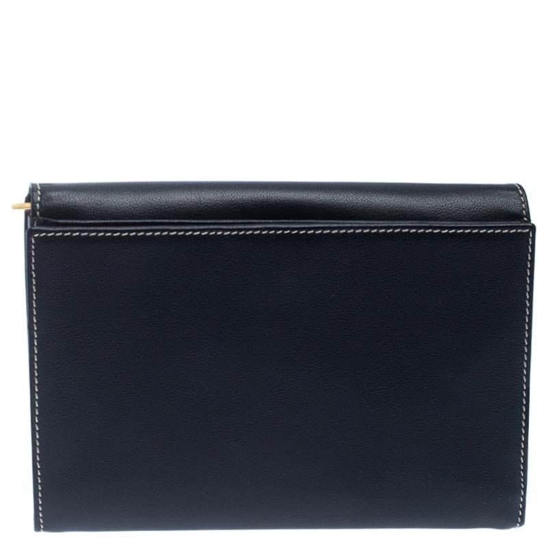 Give your essentials a stylish home with this magnificent wallet from the house of Saint Laurent Paris. Crafted from leather, it comes in a lovely shade of navy blue and has a bifold design. The spacious leather interior is equipped with a zip
