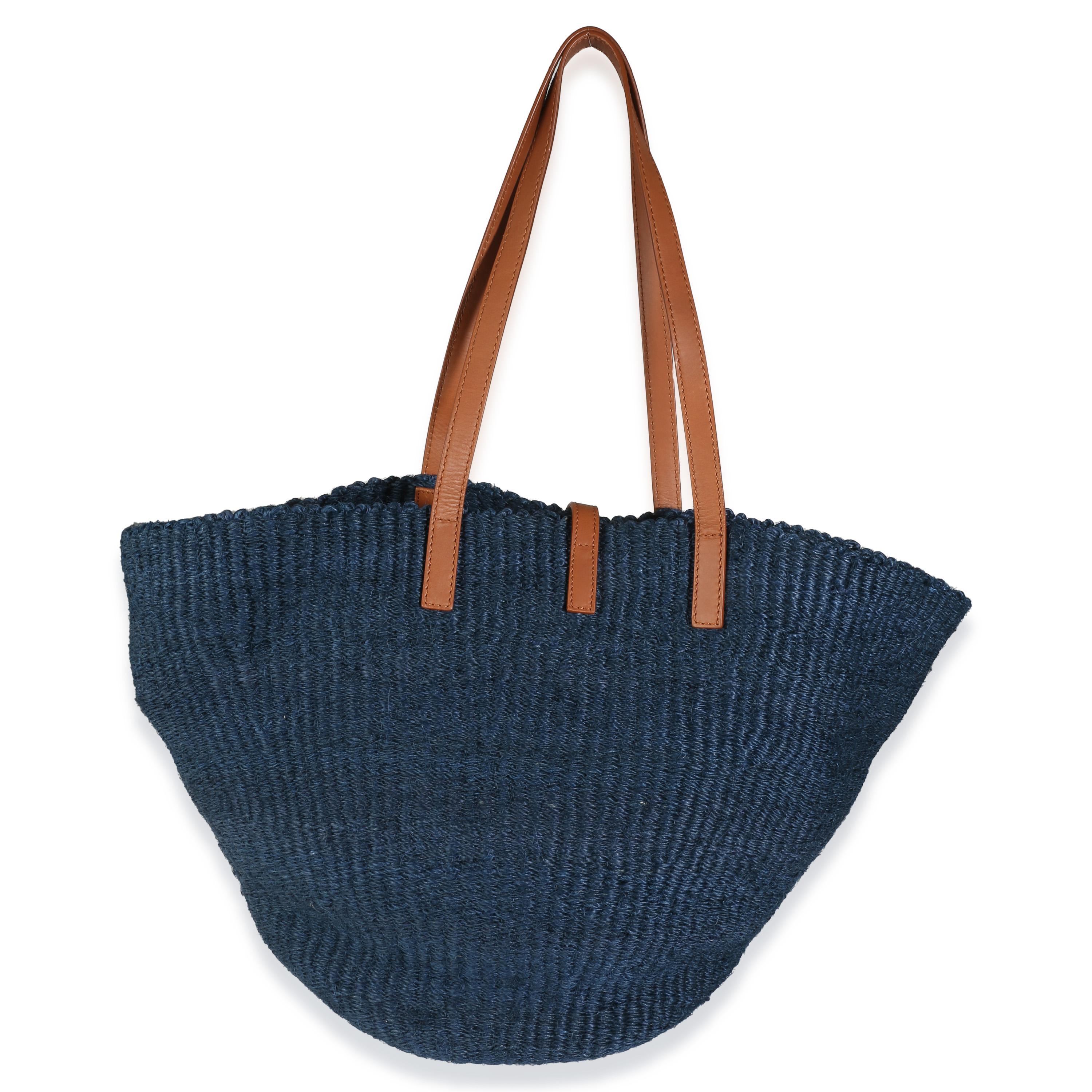 Listing Title: Saint Laurent Navy Raffia Panier Medium Tote
SKU: U140851
Condition: Pre-owned 
Handbag Condition: Excellent
Condition Comments: Item is in excellent condition and displays light signs of wear.  Minor fraying to raffia.
Brand: Saint