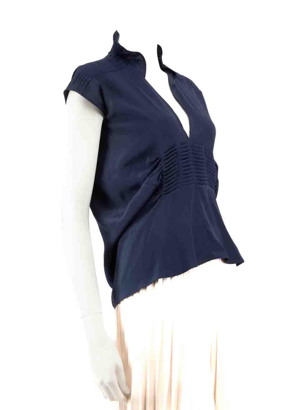 CONDITION is Good. Minor wear to blouse is evident. Light wear to the front and both underarm linings with light marks on this used Saint Laurent designer resale item.
 
Details
Navy
Silk
Blouse
Sleeveless
V-neck
Pleated detail
 
Made in