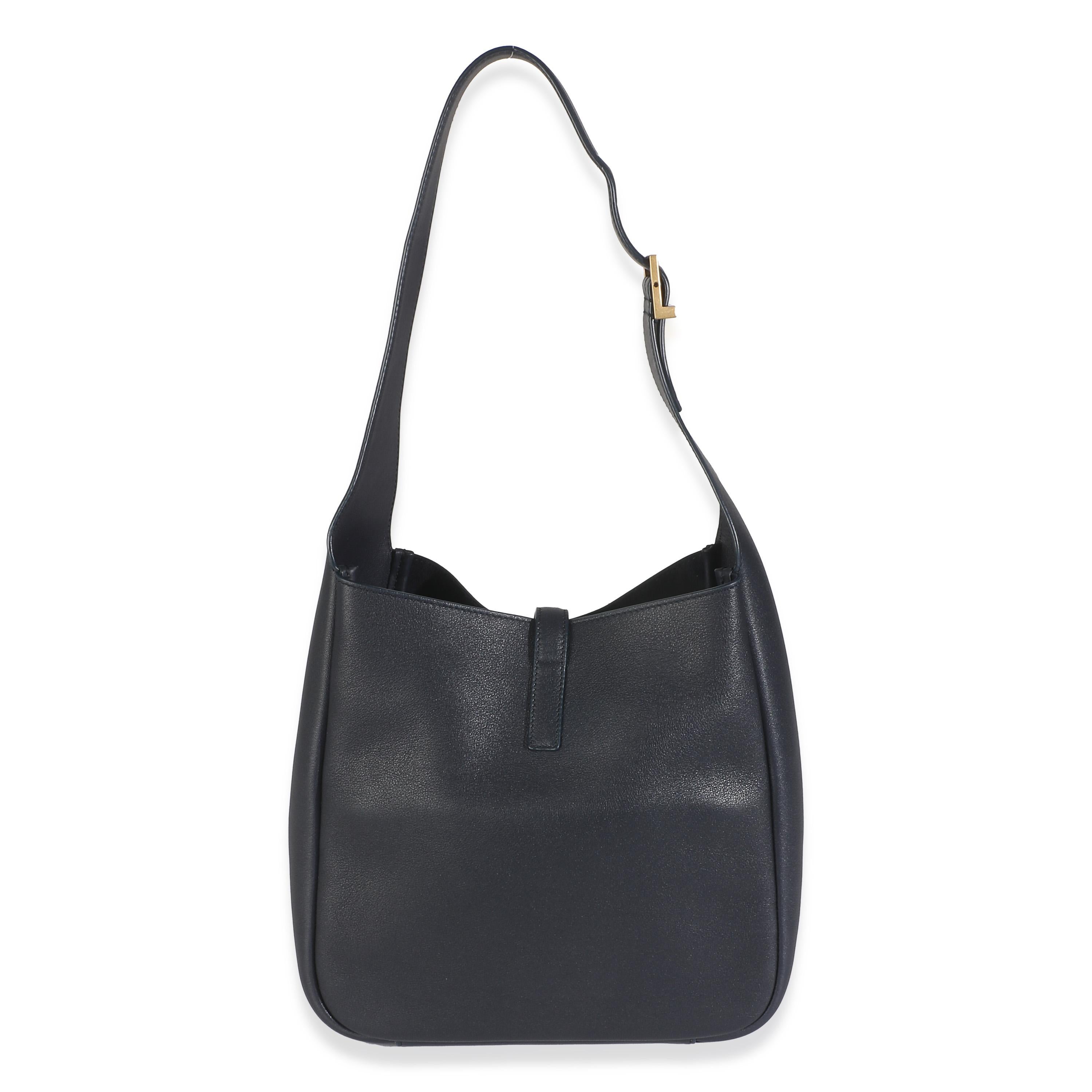 Listing Title: Saint Laurent Navy Smooth Calfskin Small Le 5 a 7 Hobo
SKU: 146153
MSRP: 2700.00 USD
Condition: Pre-owned 
Condition Description: Rive Gauche refers to the southern bank of the river Seine, otherwise known as the Left Bank or Rive