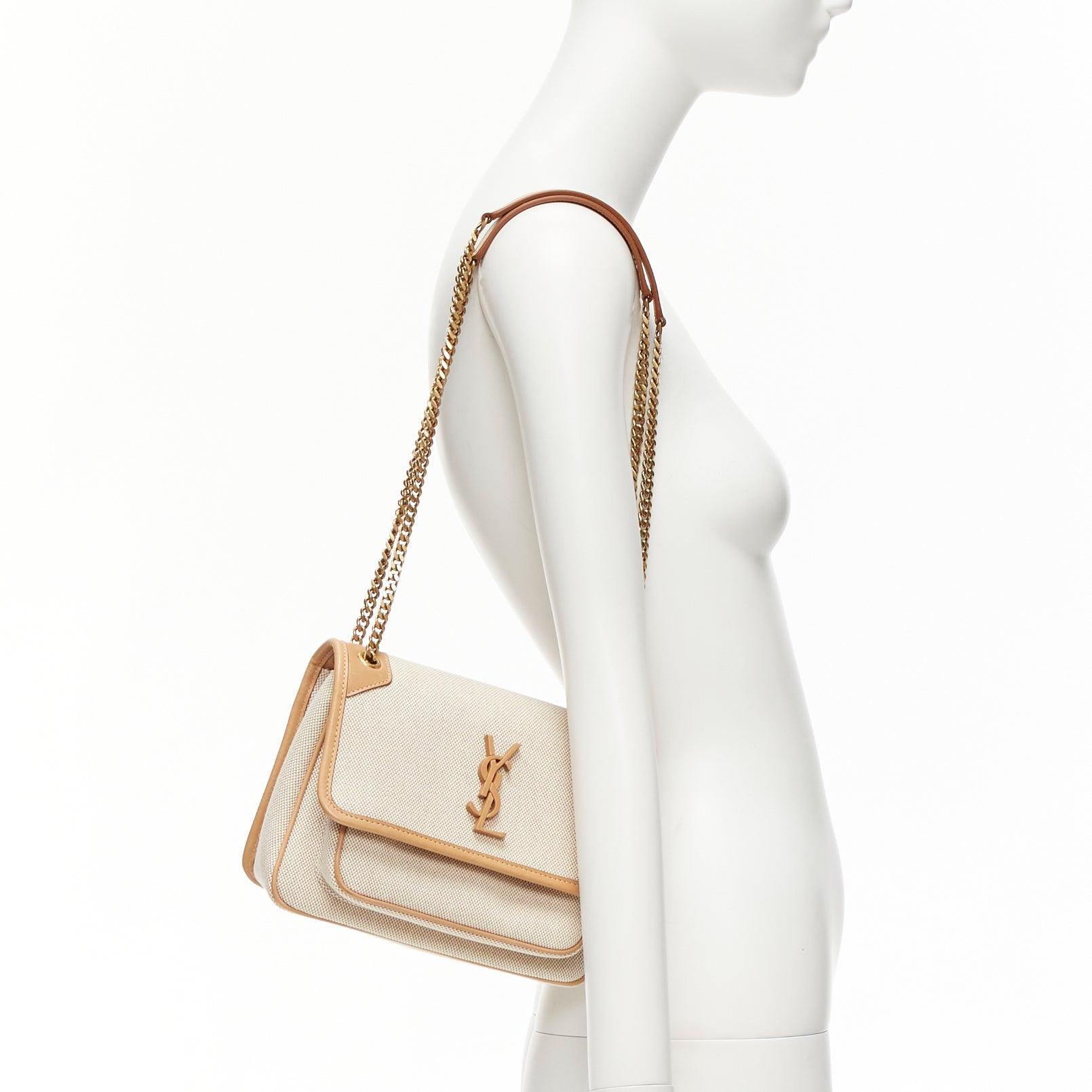 SAINT LAURENT Niki beige canvas brown leather trim logo flap crossbody chain bag
Reference: NILI/A00051
Brand: Saint Laurent
Model: Niki
Material: Leather, Canvas
Color: Beige, Brown
Pattern: Solid
Closure: Magnet
Lining: Khaki Fabric
Extra Details: