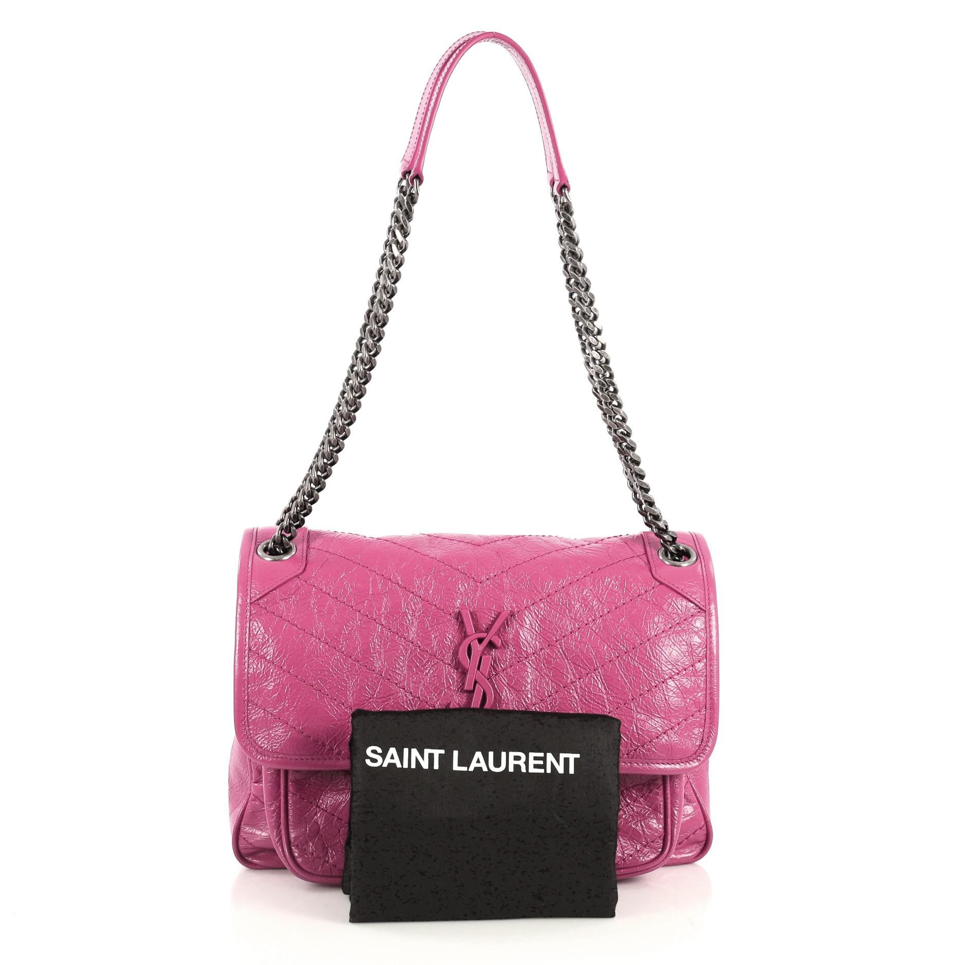 This Saint Laurent Niki Chain Flap Bag Matelasse Chevron Leather Medium, crafted in pink matelasse chevron leather, features chain link shoulder strap with shoulder pad, frontal flap with YSL monogram detail and aged silver-tone hardware. Its