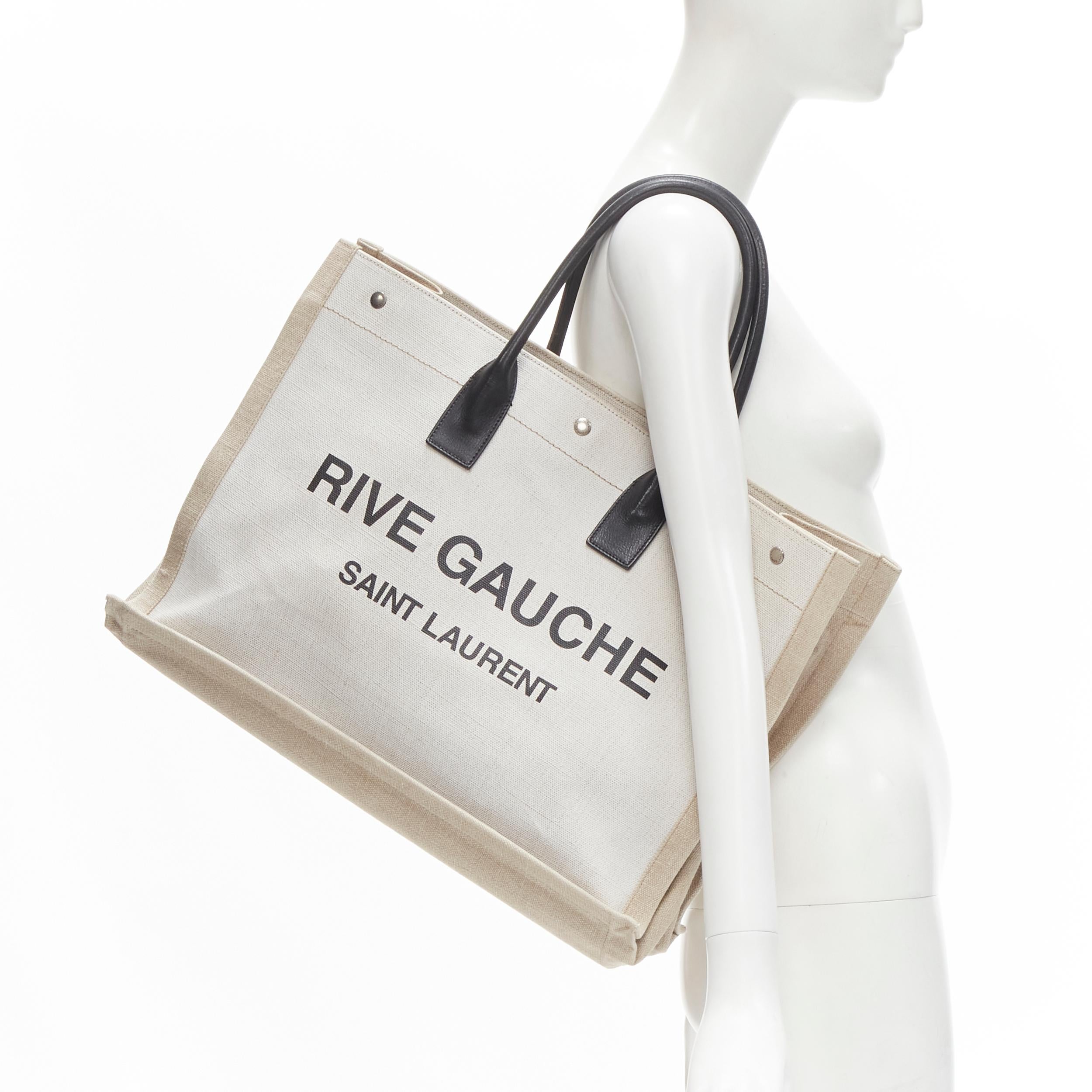 SAINT LAURENT Noe Rive Gauche logo print canvas leather handle tote bag
Brand: Saint Laurent
Model: Noe
Material: Canvas
Color: Beige
Pattern: Solid
Extra Detail: Two-tone canvas upper. Black log print. Black genuine rolled leather handle.